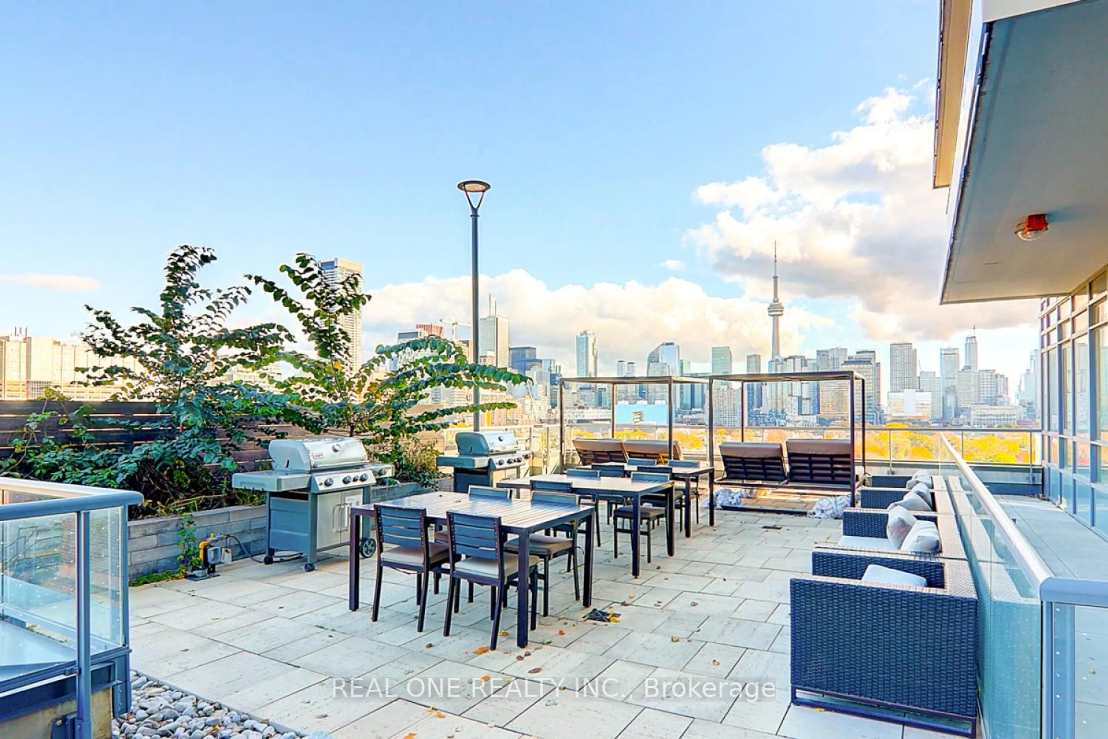 Patio, city buildings view from balcony for 181 Huron St #201, Toronto Ontario M5T 0C1