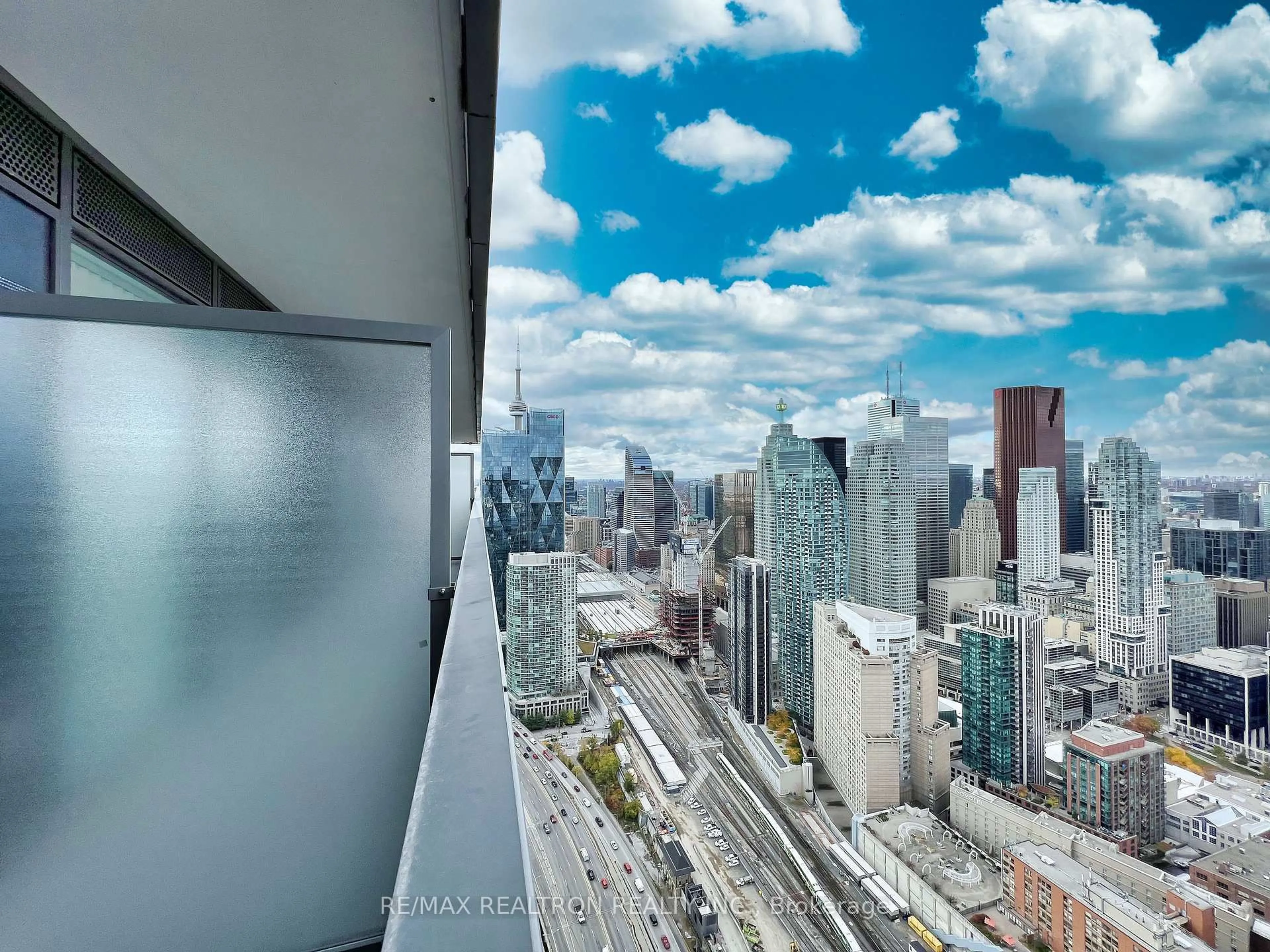 Balcony in the apartment, city buildings view from balcony for 55 Cooper St #6303, Toronto Ontario M5E 0G1