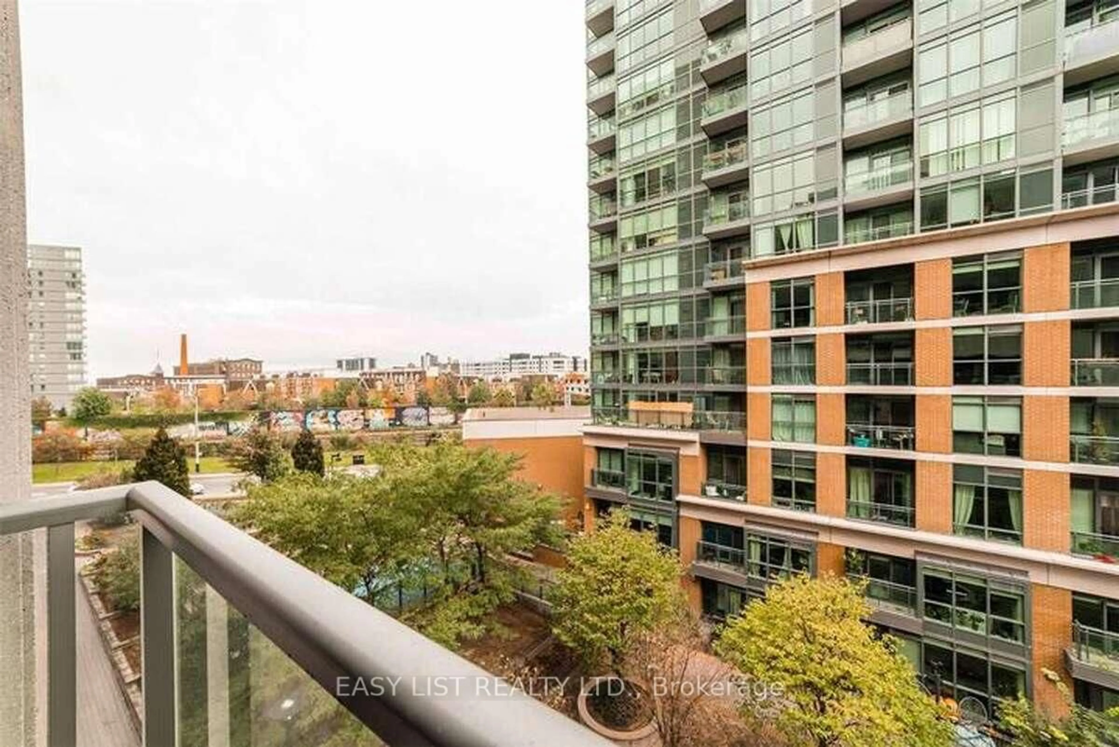 Patio, city buildings view from balcony for 68 Abell St #307, Toronto Ontario M6J 0B1
