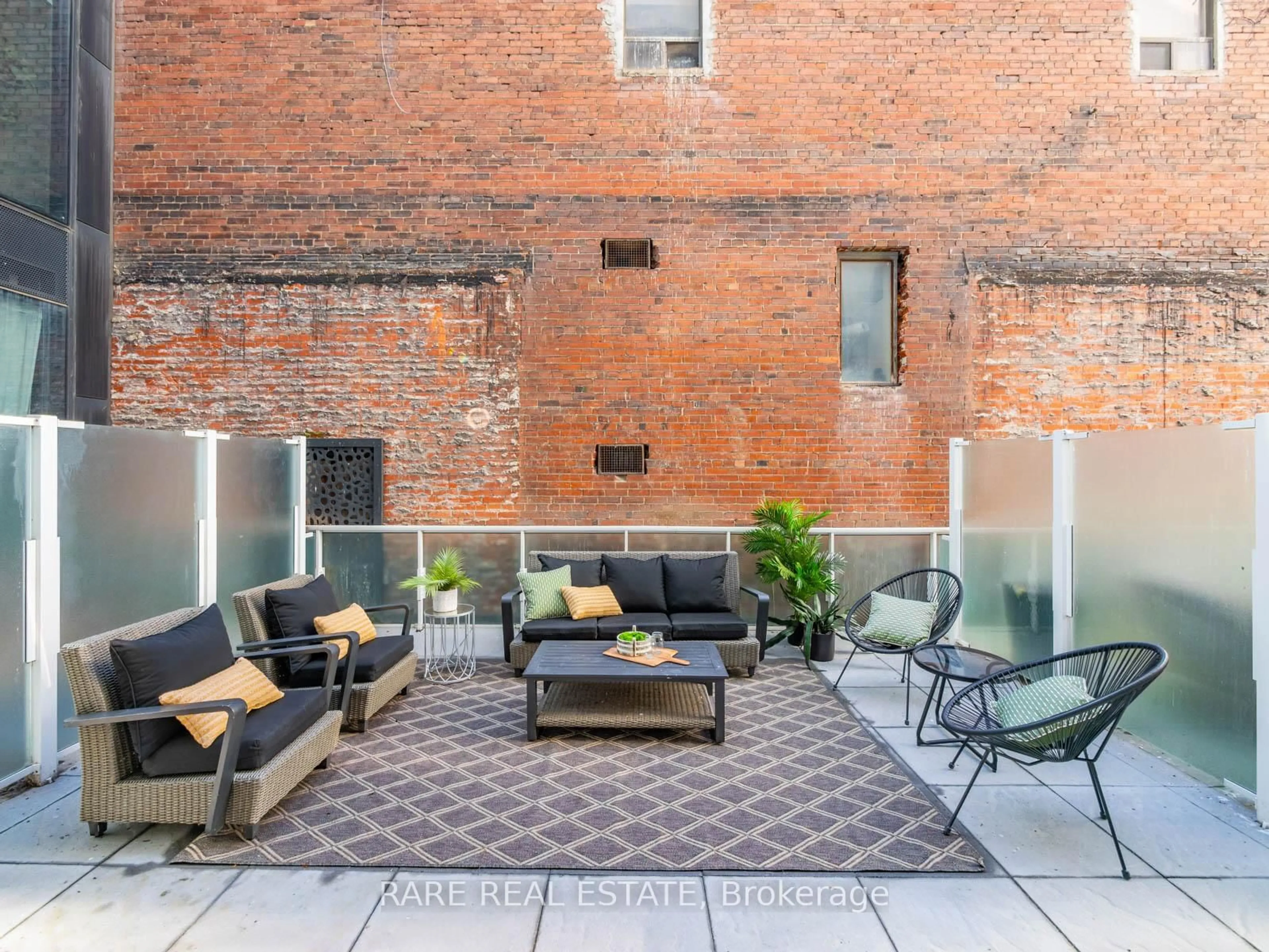 Patio, city buildings view from balcony for 11 Charlotte St #206, Toronto Ontario M5V 2H5