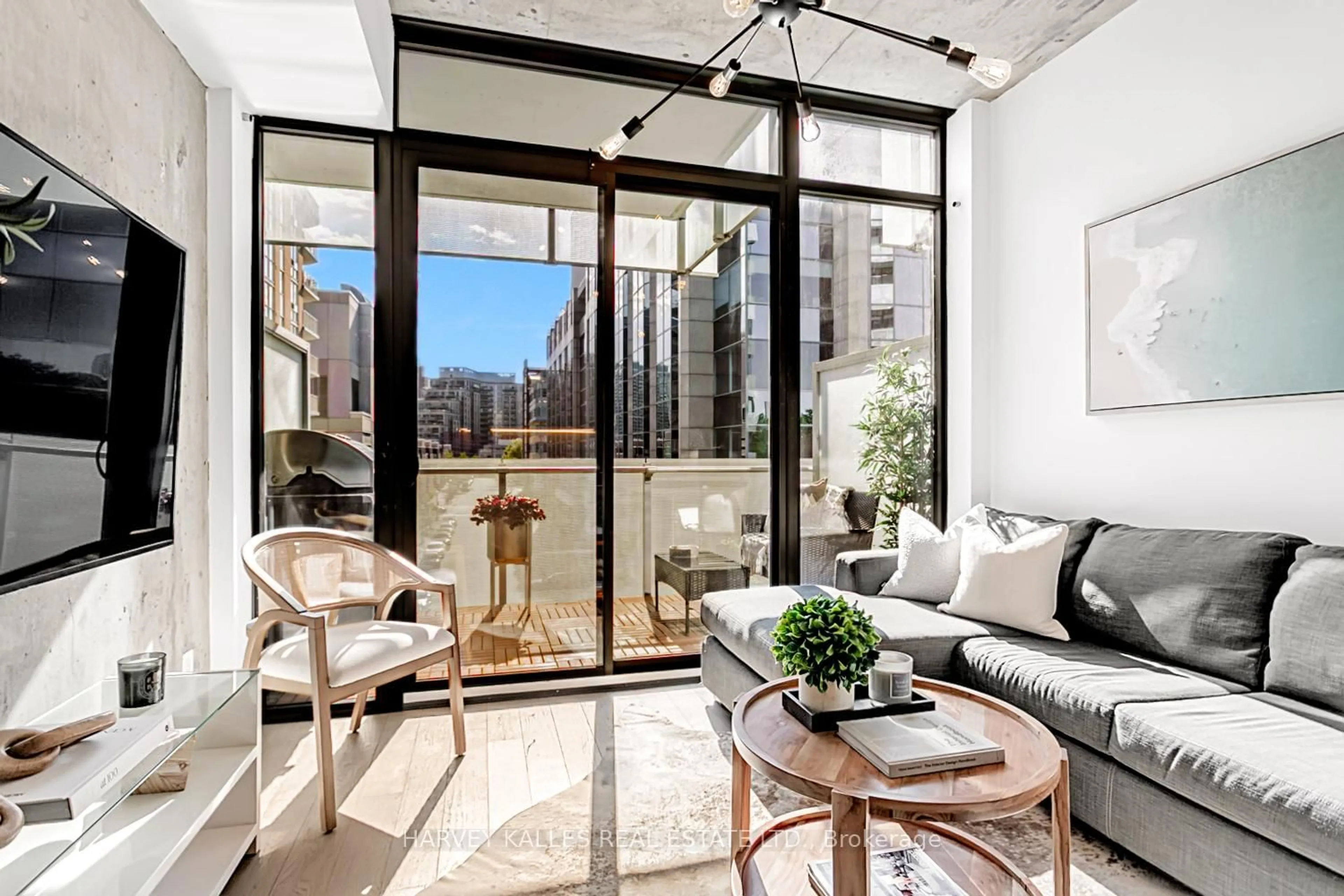 Living room with furniture, cement floor for 25 Stafford St #406, Toronto Ontario M5V 0G3