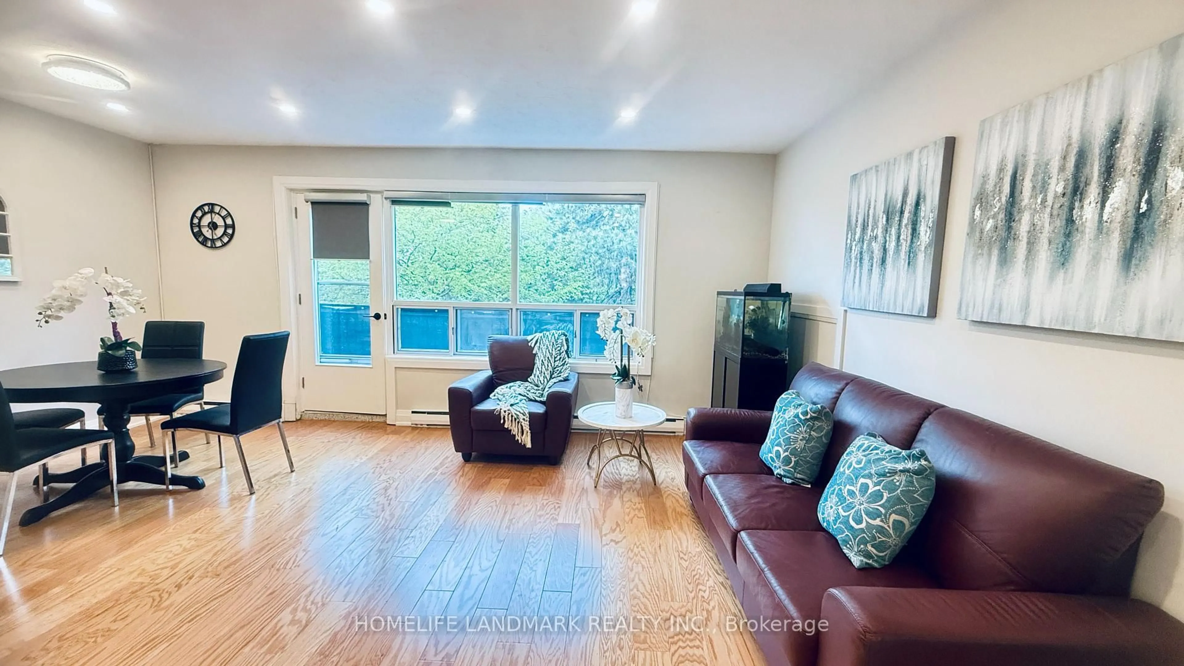 Living room with furniture, wood/laminate floor for 5879 Bathurst St #213, Toronto Ontario M2R 1Y7