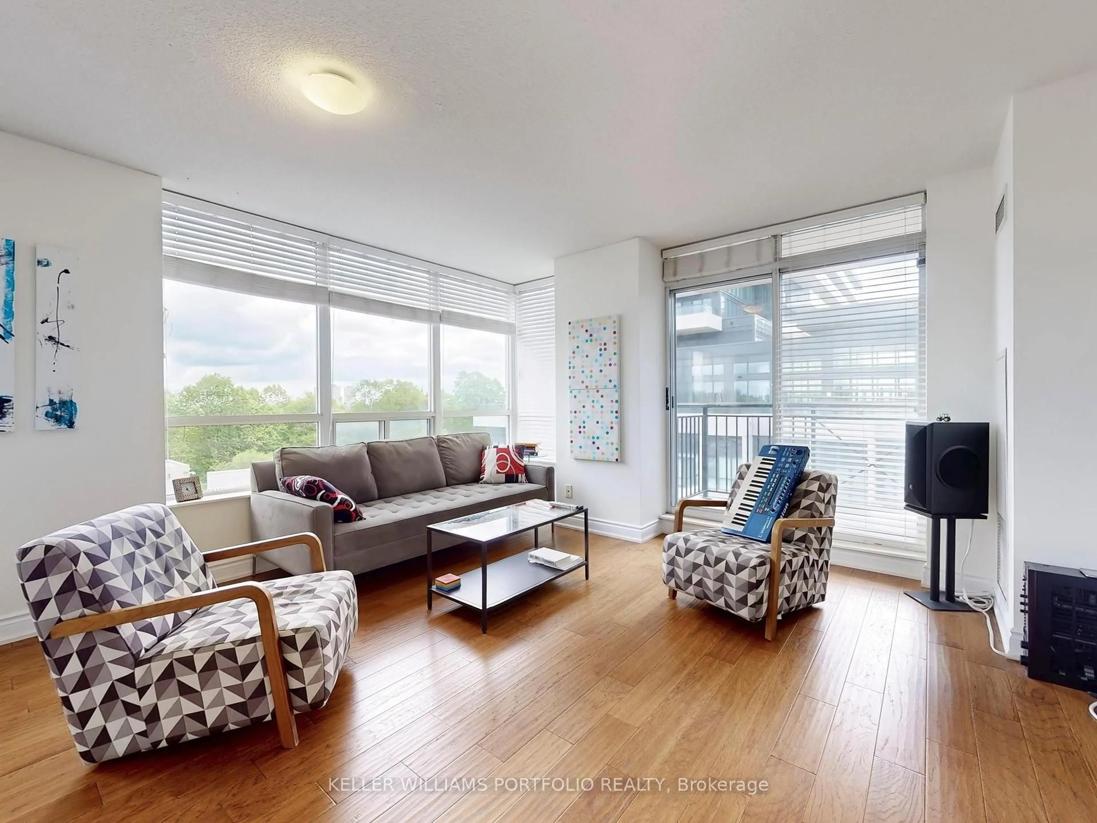 Living room with furniture, wood/laminate floor for 1103 Leslie St #503, Toronto Ontario M3C 4G8