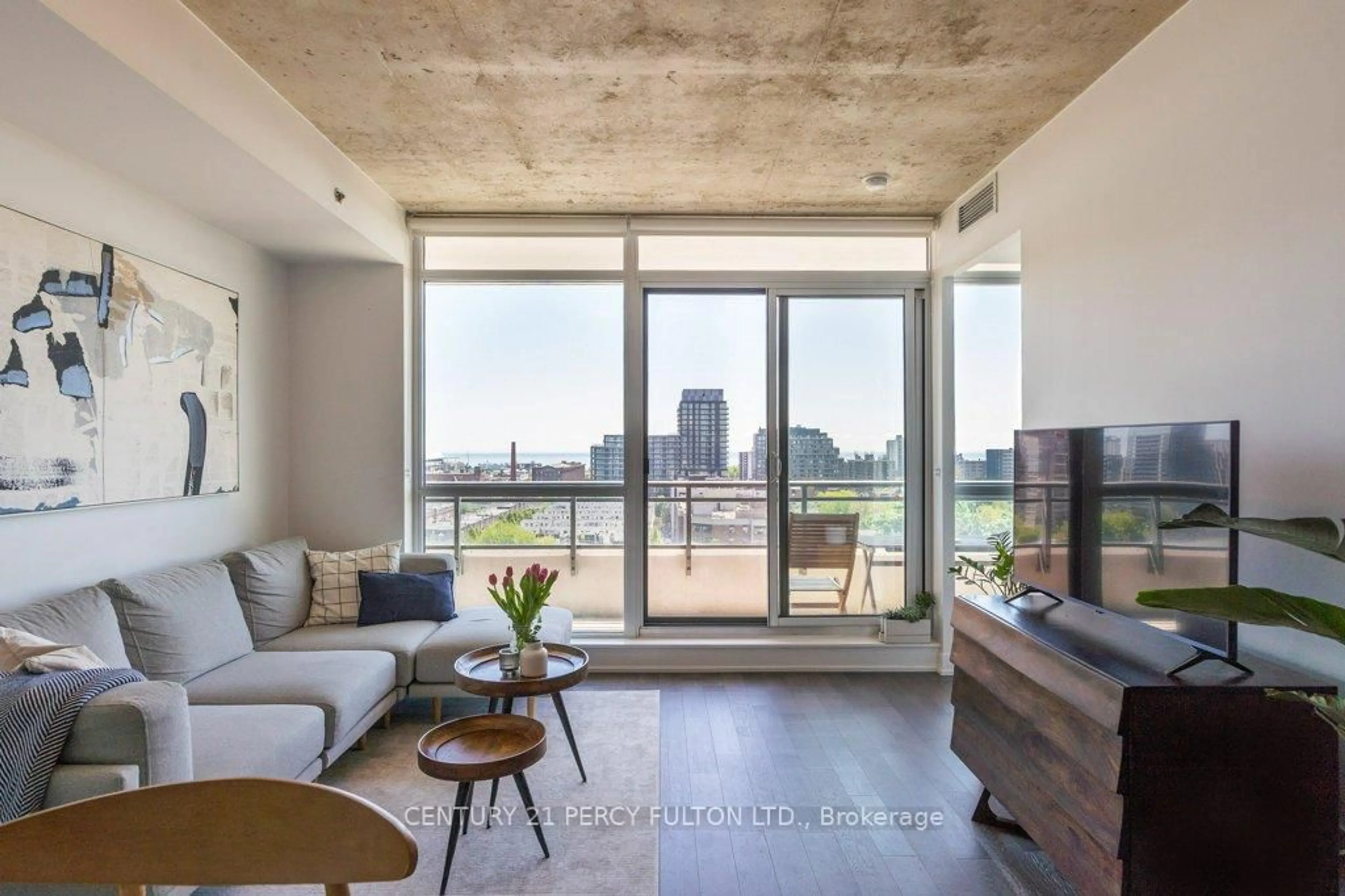 Living room with furniture, cement floor for 20 Minowan Miikan Lane #1307, Toronto Ontario M6J 0E5