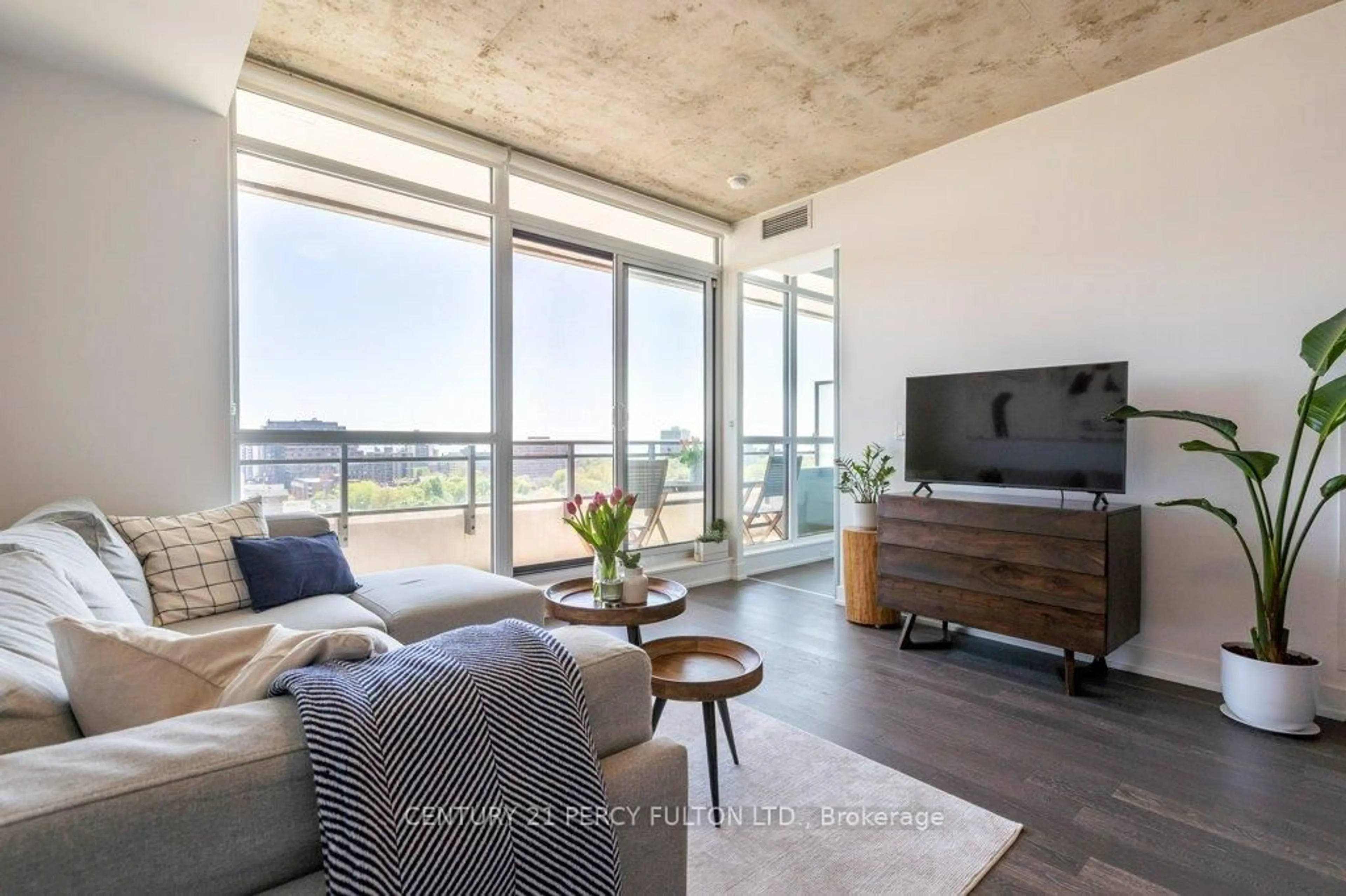 Living room with furniture, cement floor for 20 Minowan Miikan Lane #1307, Toronto Ontario M6J 0E5