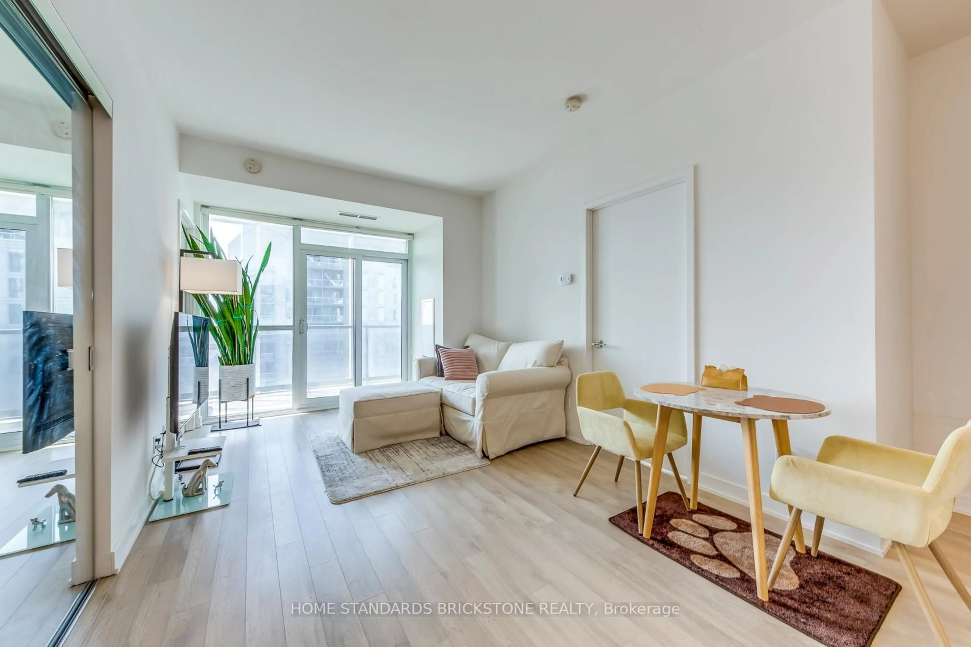 Living room with furniture, wood/laminate floor for 50 Ordnance St #2212, Toronto Ontario M6K 0C9