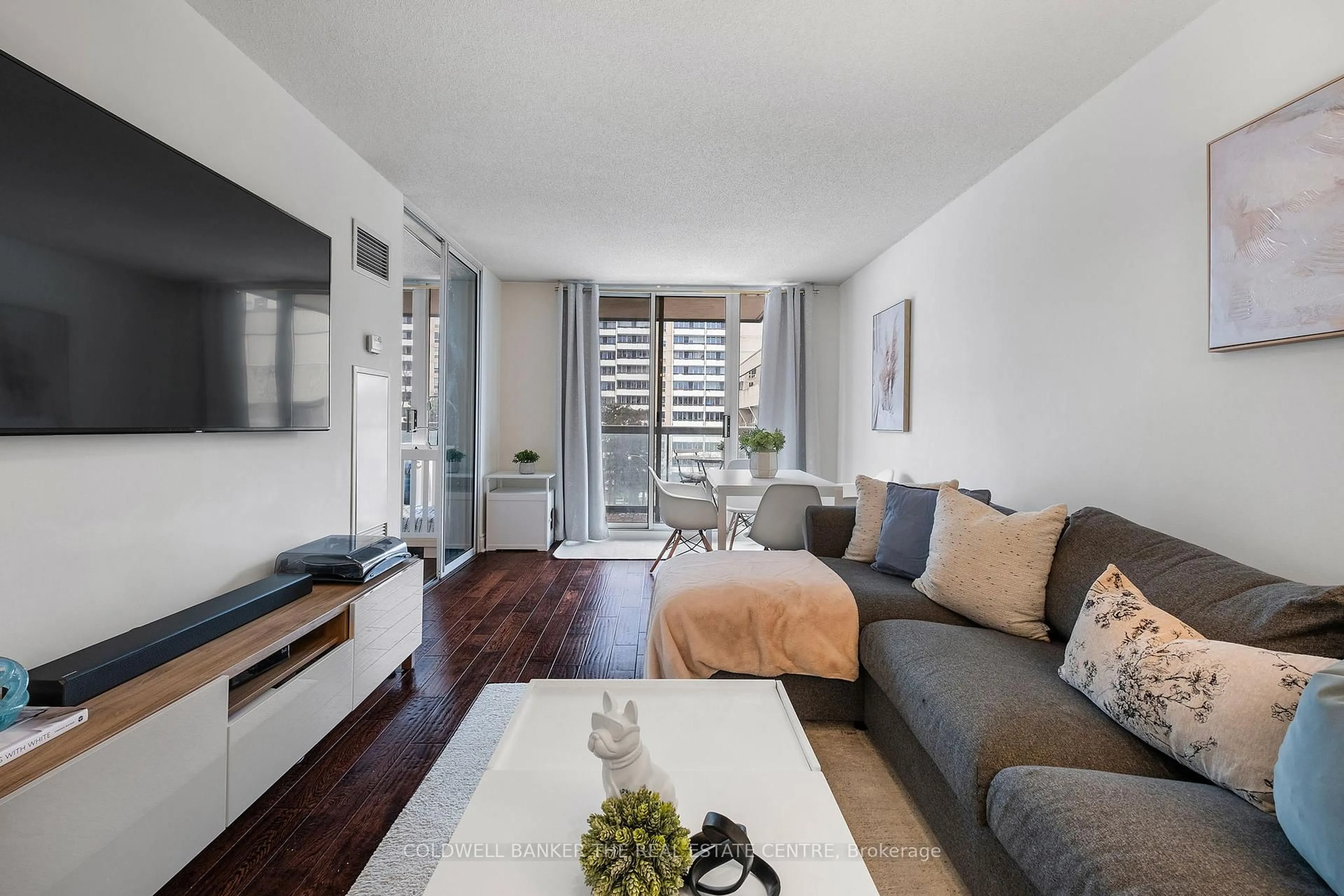 Living room with furniture, wood/laminate floor for 253 Merton St #510, Toronto Ontario M4S 3H2