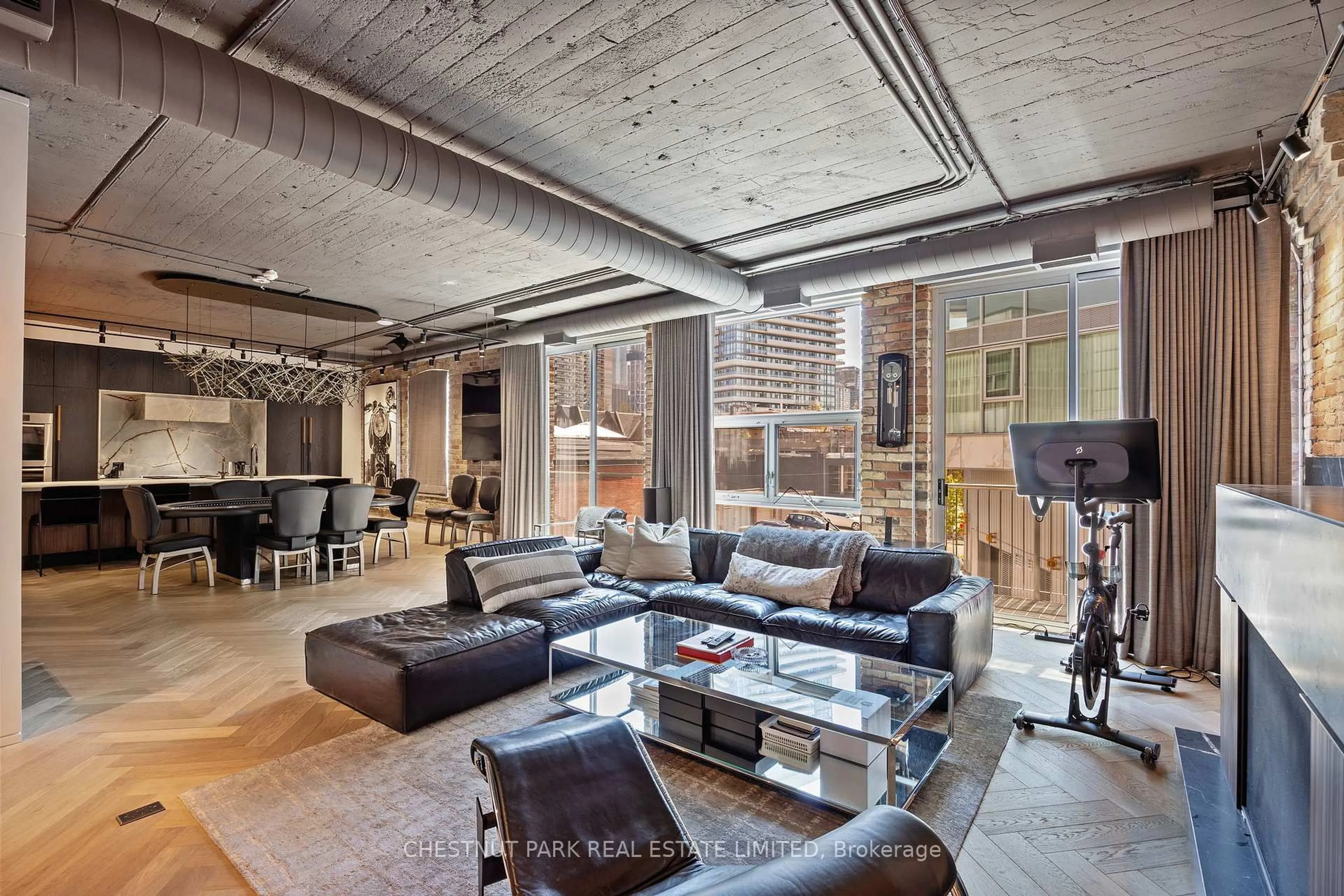 Living room with furniture, cement floor for 113 Dupont St #201, Toronto Ontario M5R 1V4