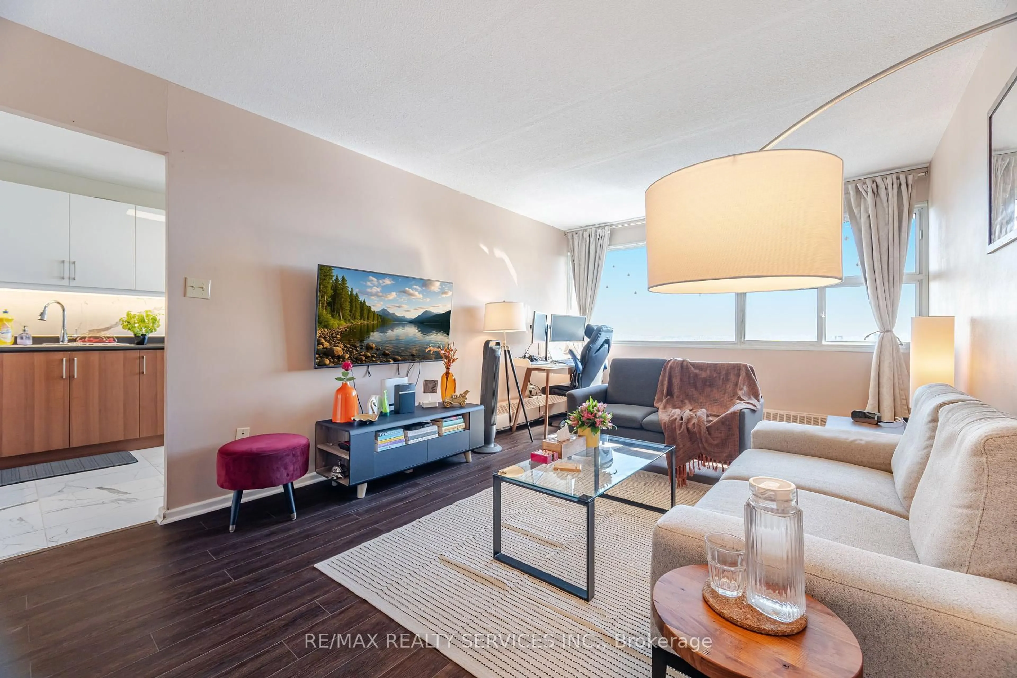 Living room with furniture, wood/laminate floor for 715 Don Mills Rd #2304, Toronto Ontario M3C 1S5