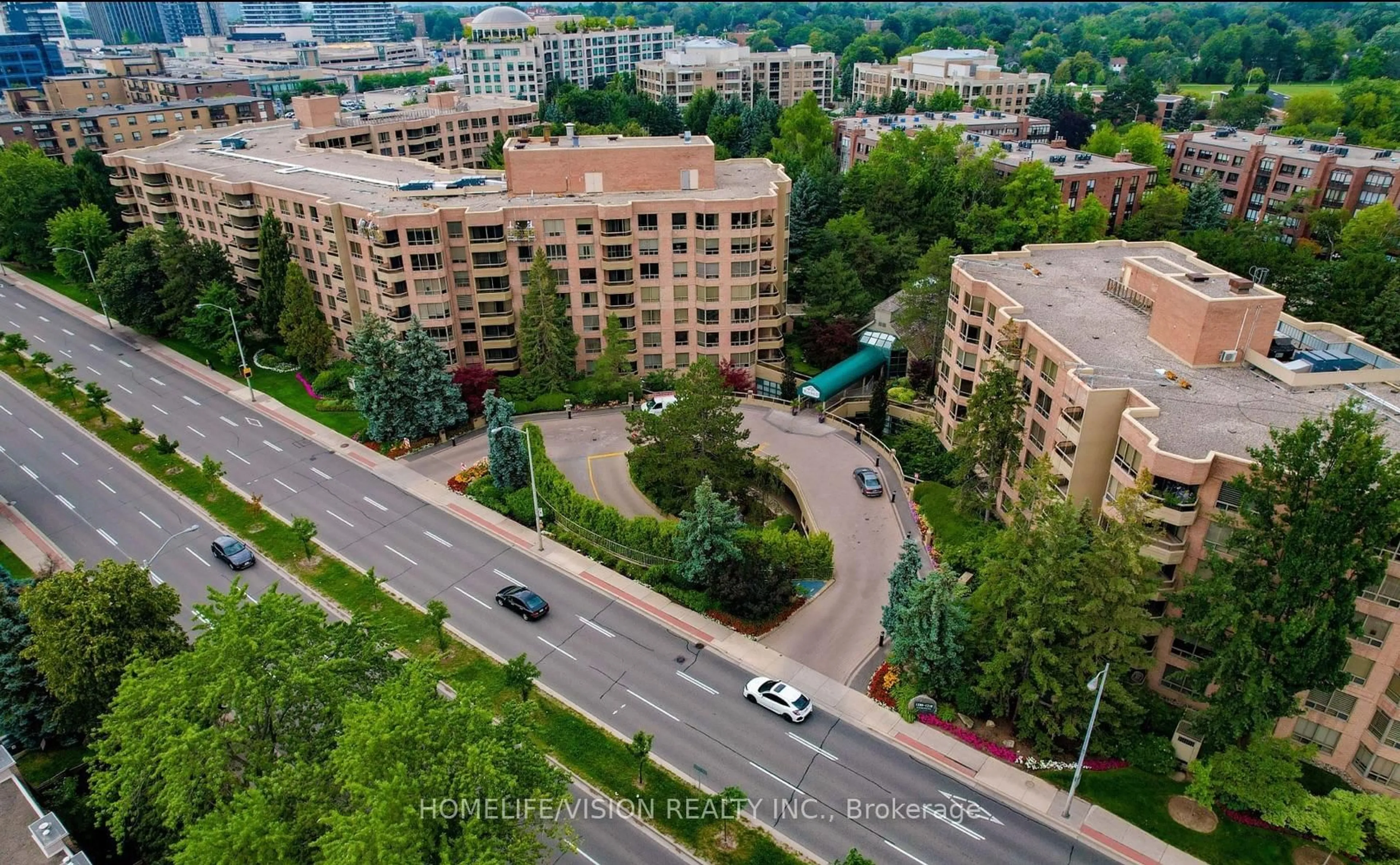 A pic from outside/outdoor area/front of a property/back of a property/a pic from drone, city buildings view from balcony for 1200 Don Mills Rd #101, Toronto Ontario M3B 3N8