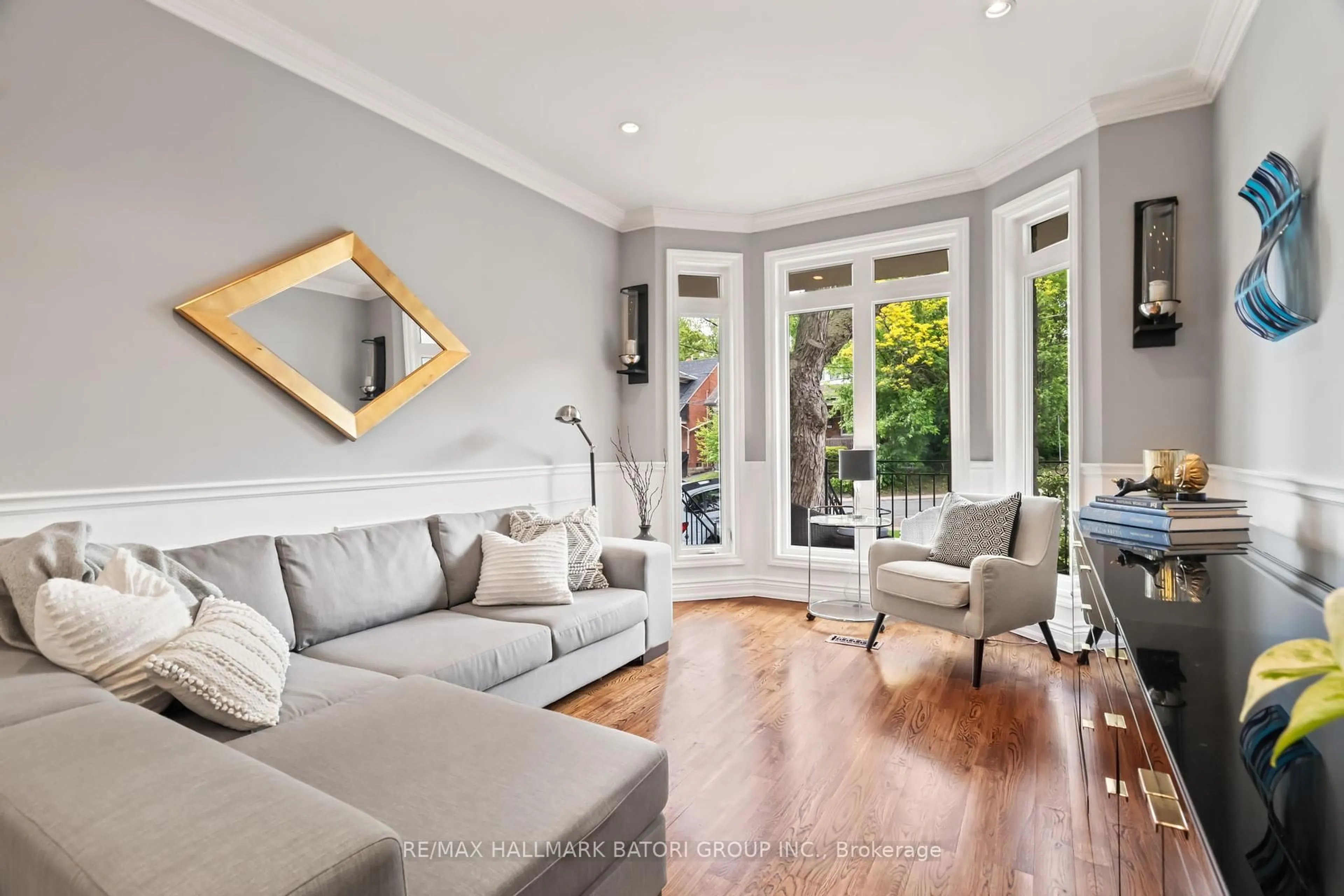 Living room with furniture, wood/laminate floor for 316 Roselawn Ave, Toronto Ontario M4R 1G1