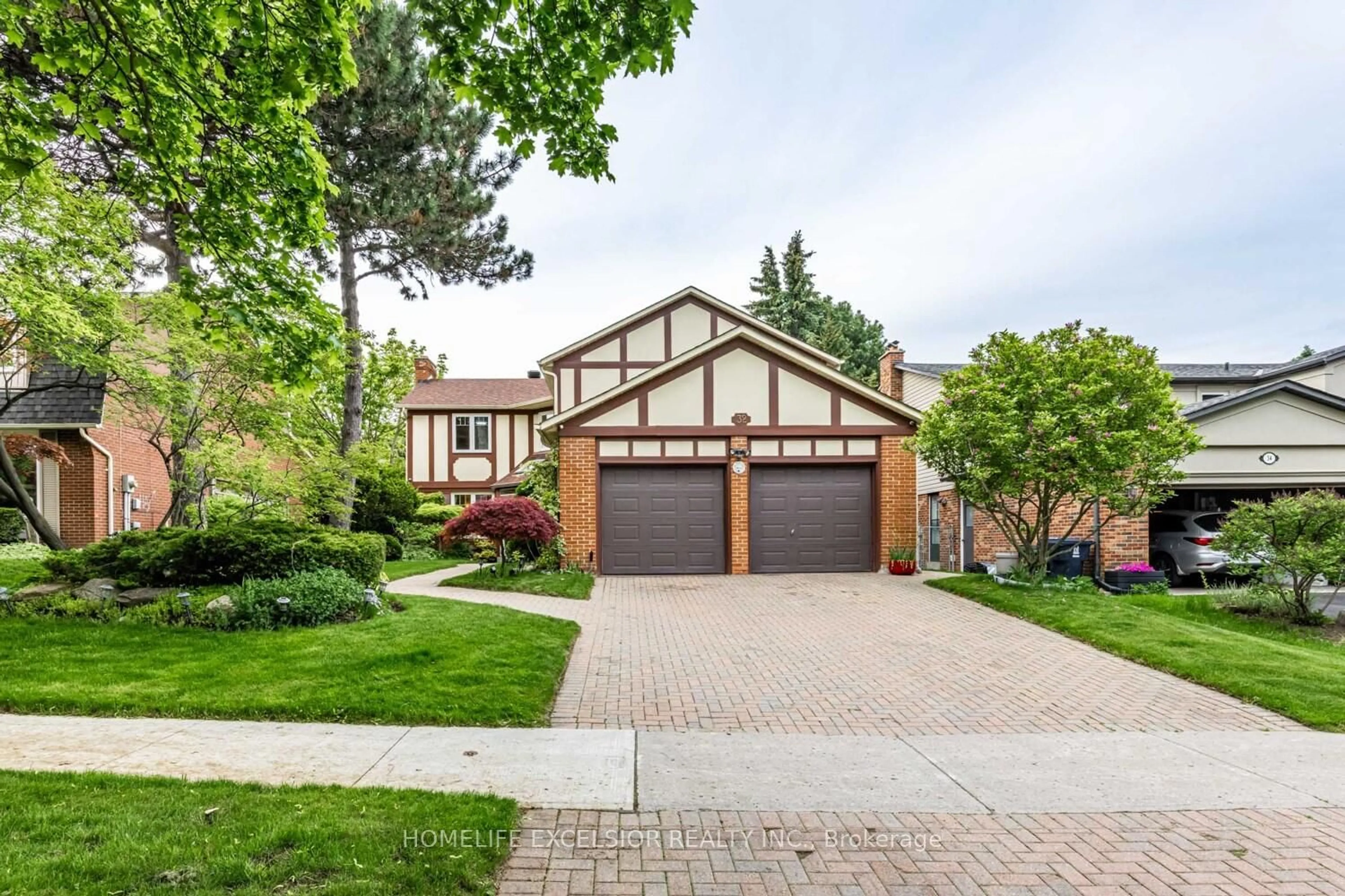 Home with brick exterior material, street for 32 Mossgrove Tr, Toronto Ontario M2L 2W3