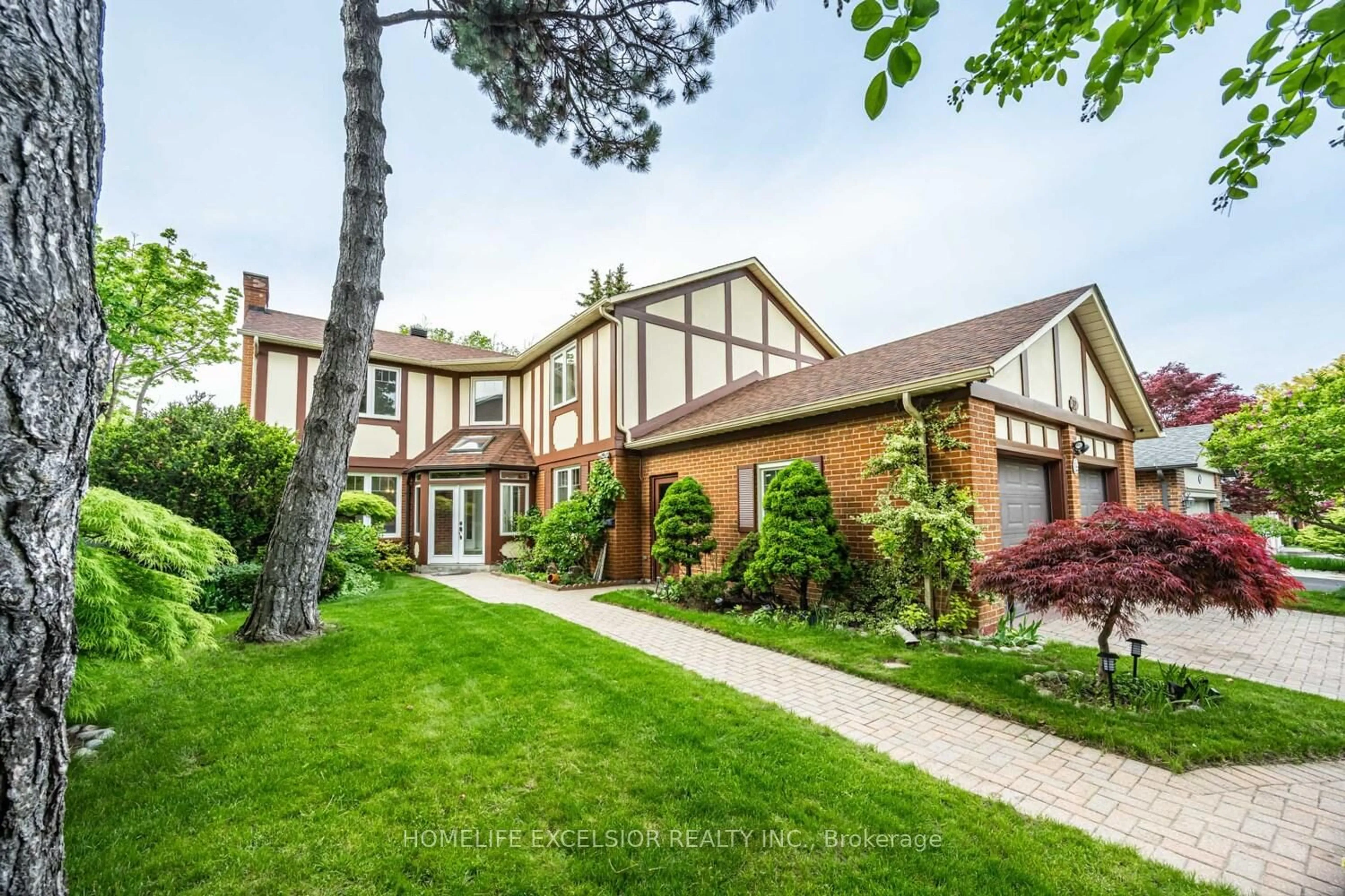 Home with brick exterior material, street for 32 Mossgrove Tr, Toronto Ontario M2L 2W3