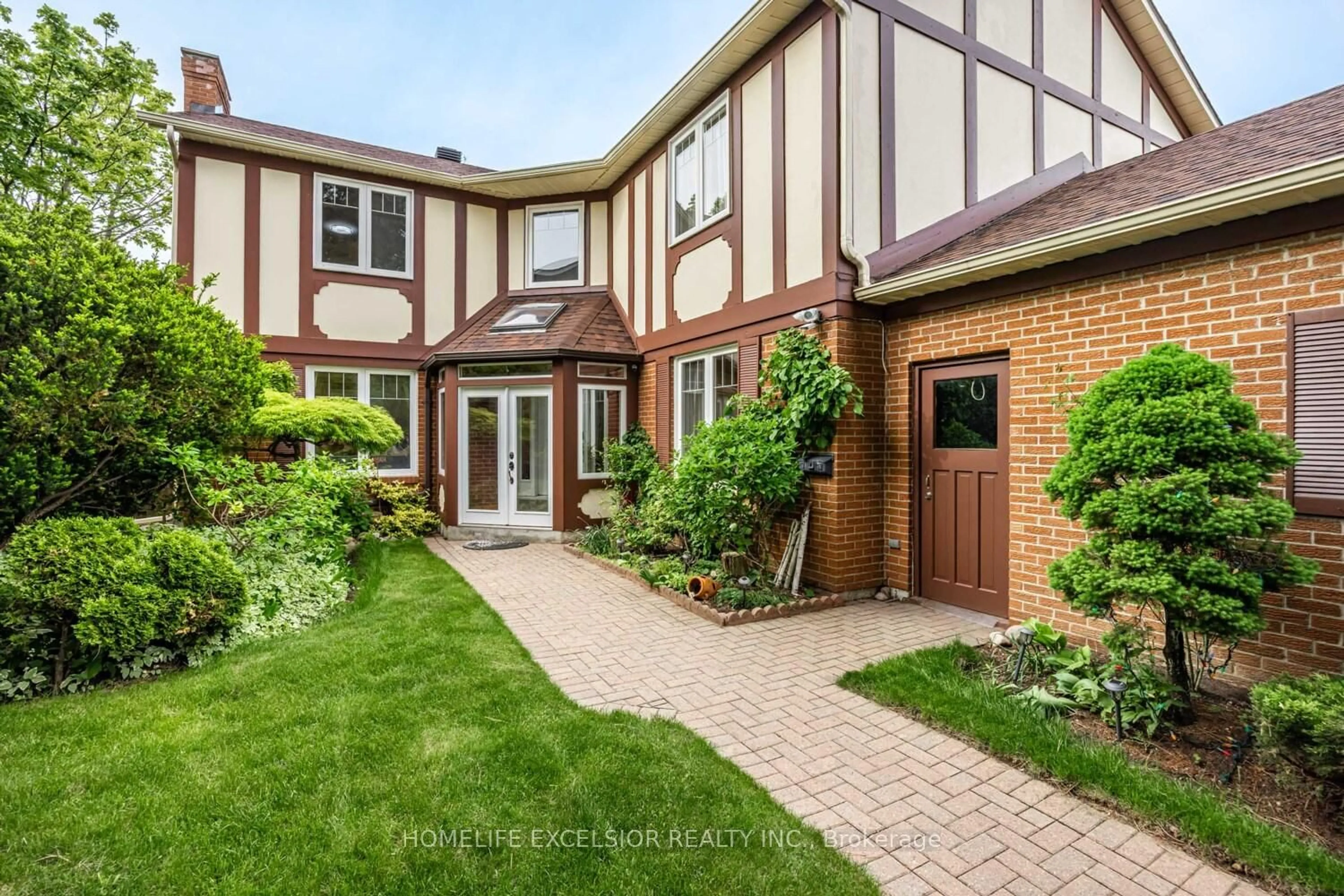 Home with brick exterior material, street for 32 Mossgrove Tr, Toronto Ontario M2L 2W3