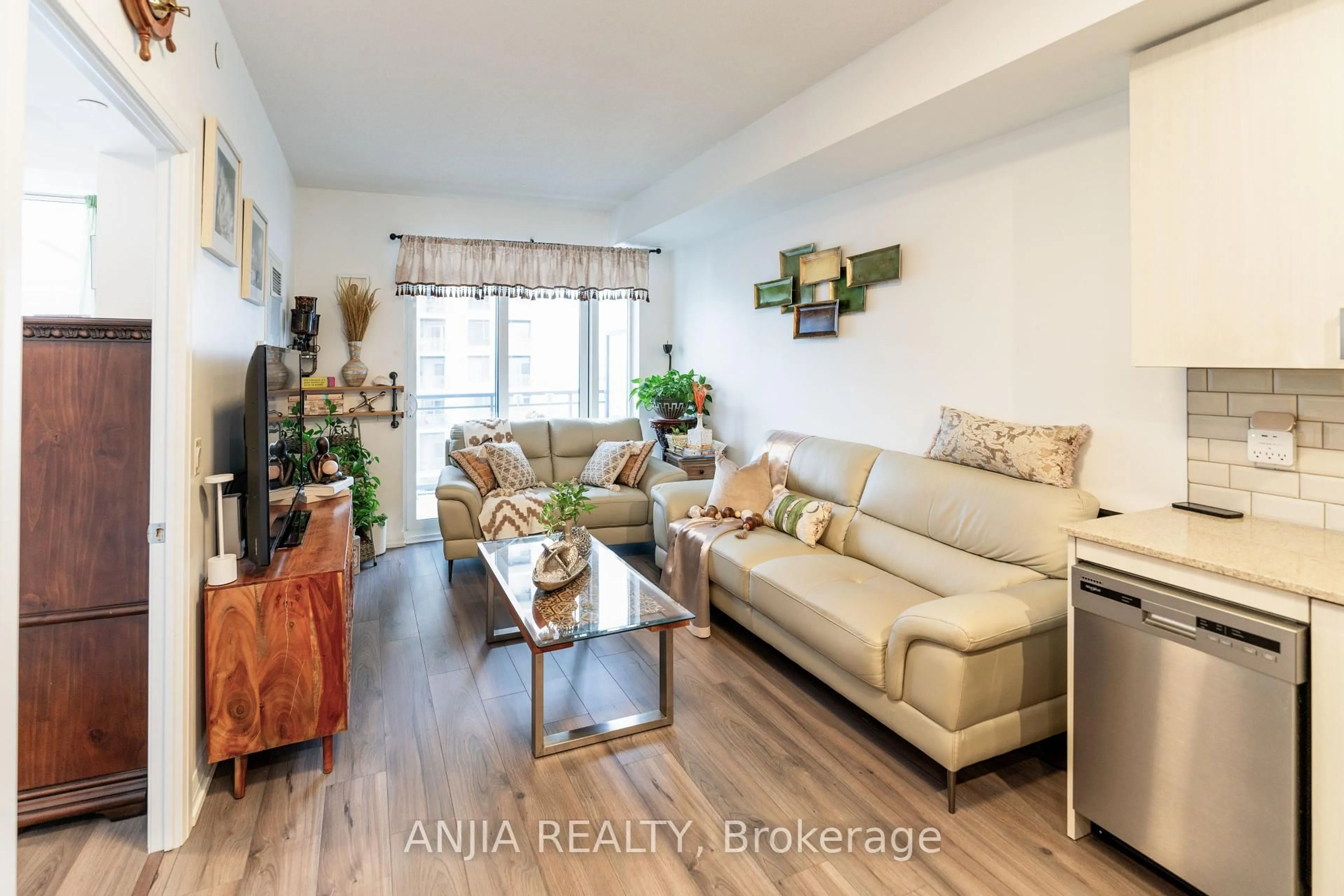 Living room with furniture, wood/laminate floor for 50 Ann Oreilly Rd #1406, Toronto Ontario M2J 0C9