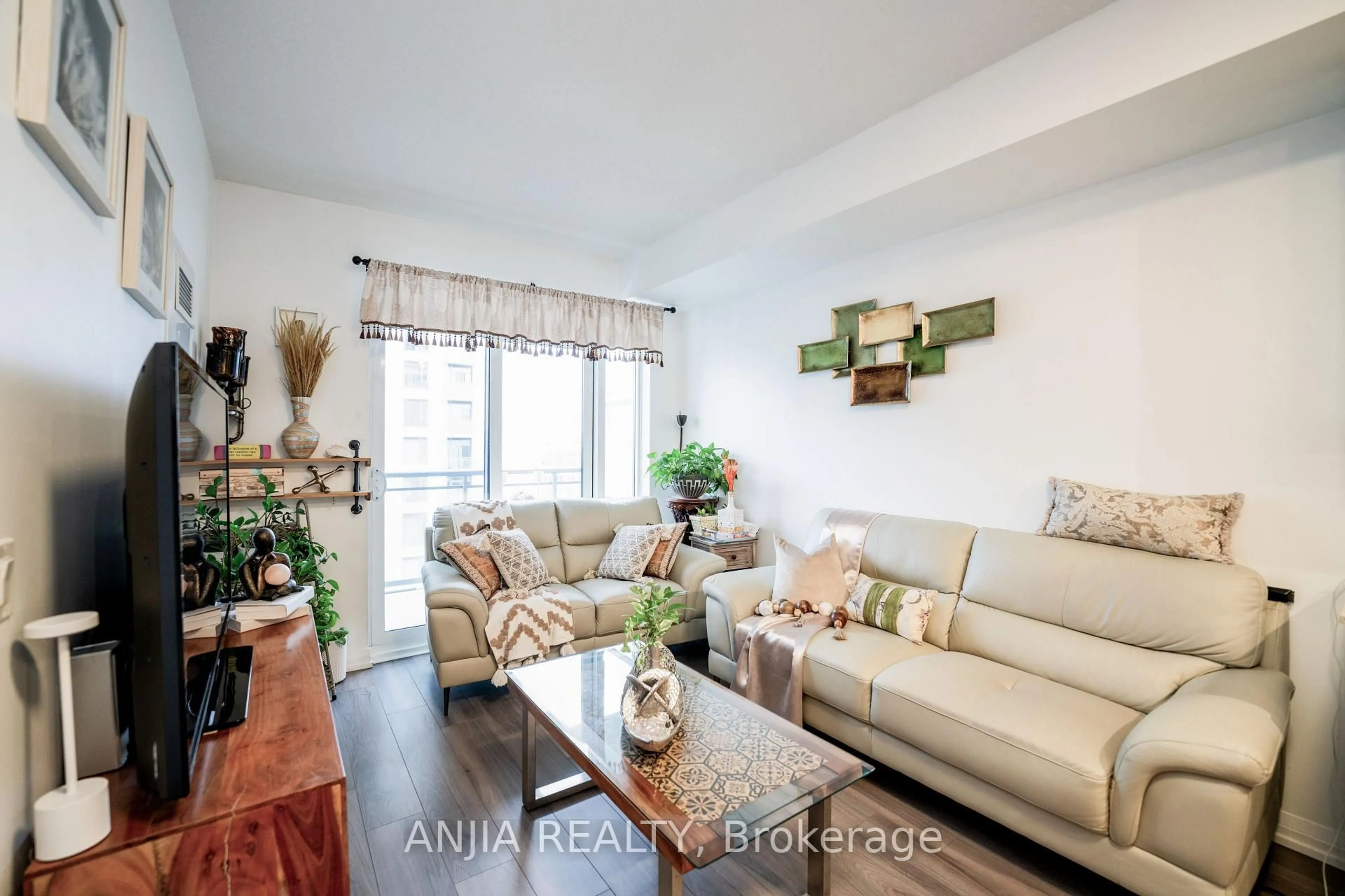 Living room with furniture, wood/laminate floor for 50 Ann Oreilly Rd #1406, Toronto Ontario M2J 0C9