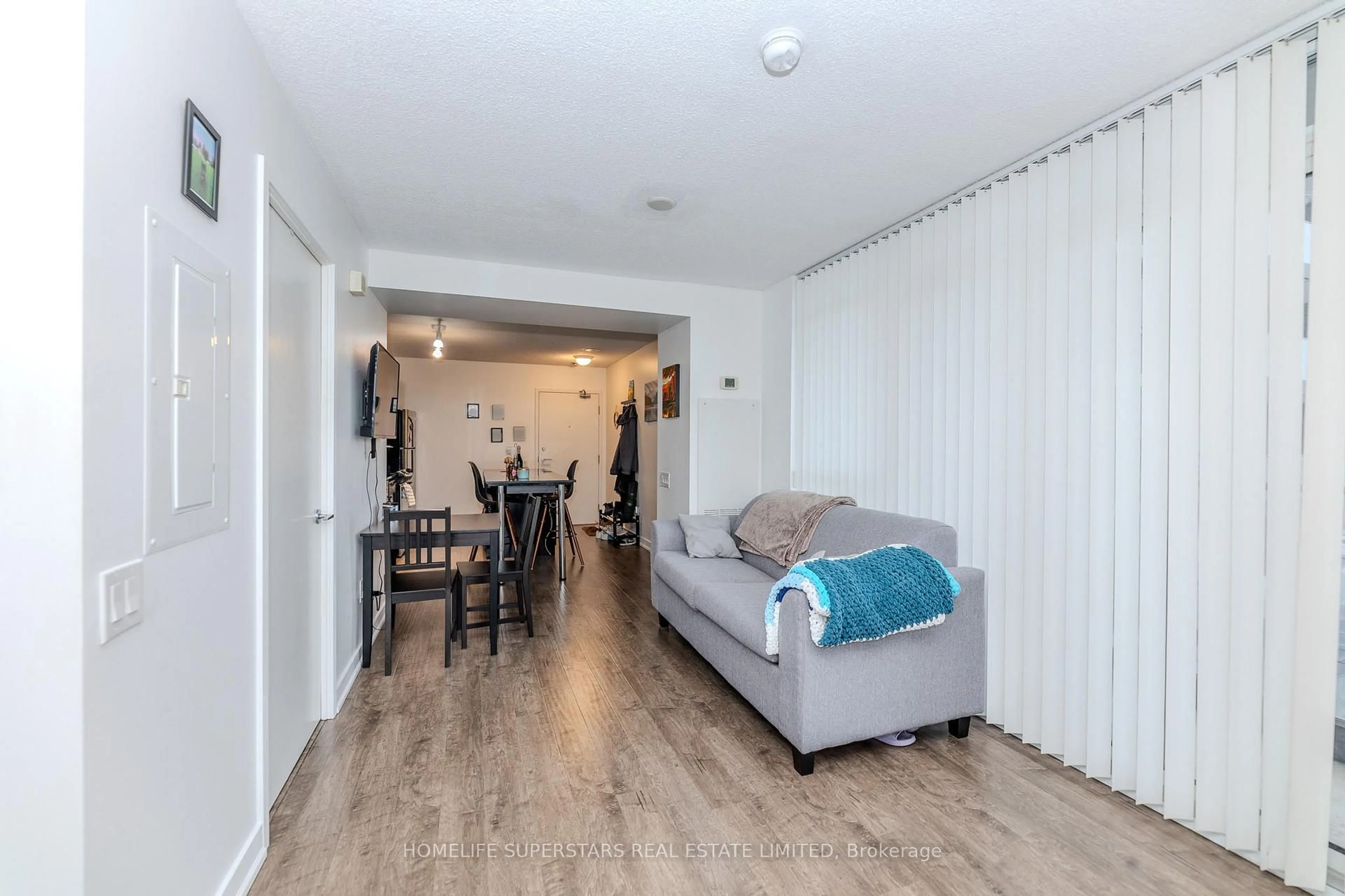 Living room with furniture, wood/laminate floor for 19 Singer Crt #601 A, Toronto Ontario M2K 0B2