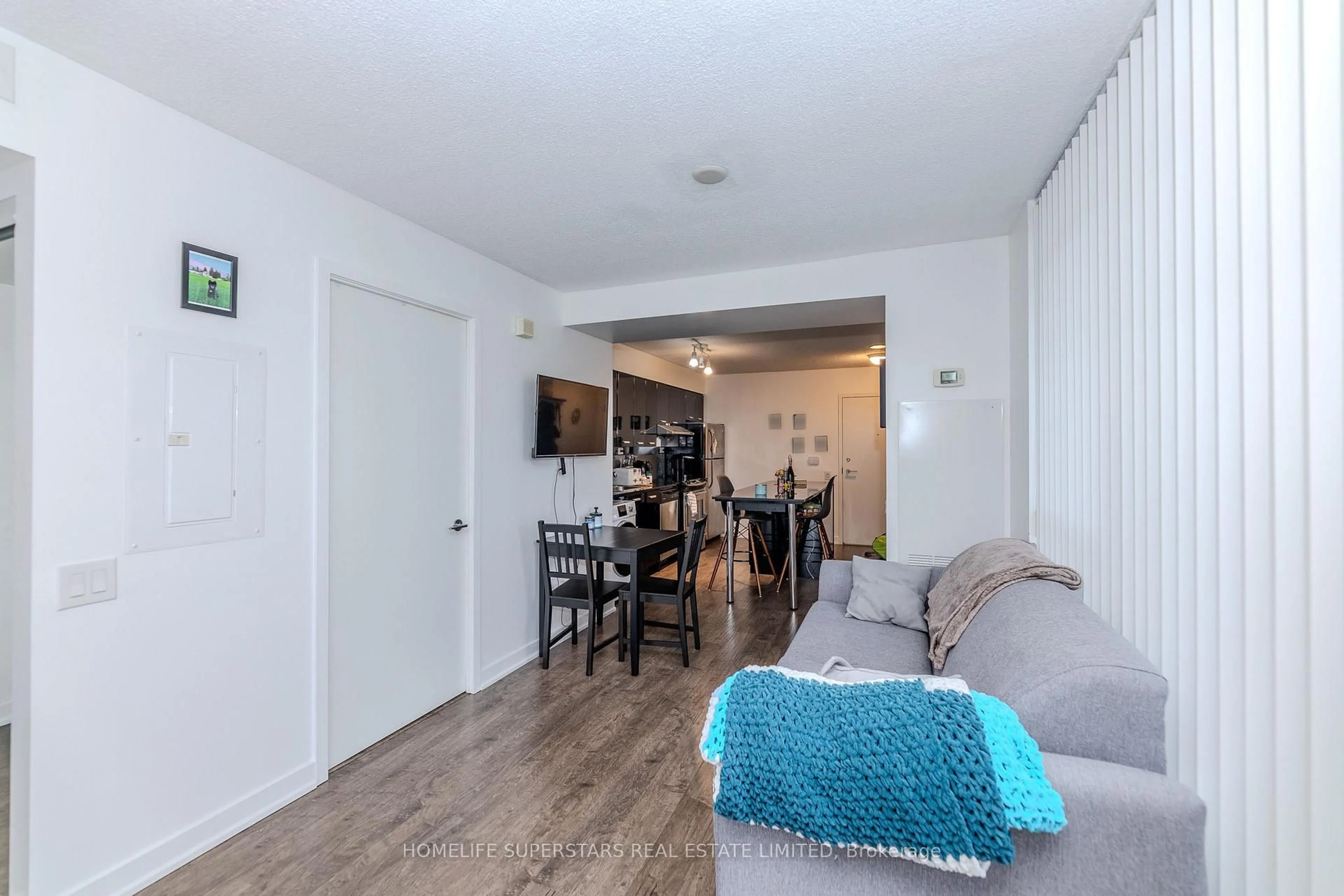 Living room with furniture, wood/laminate floor for 19 Singer Crt #601 A, Toronto Ontario M2K 0B2