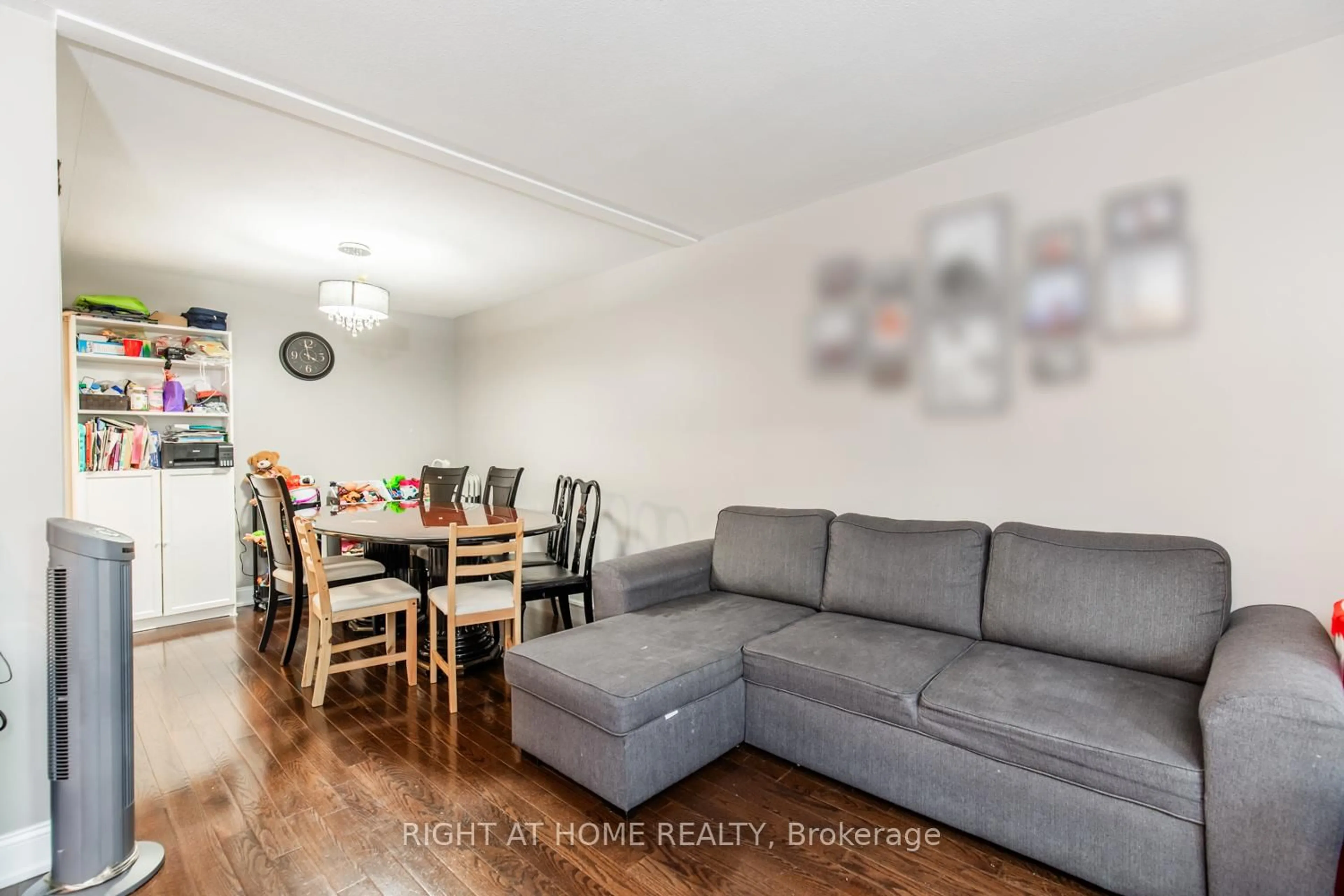 Living room with furniture, wood/laminate floor for 12 Murellen Cres, Toronto Ontario M4A 2K5