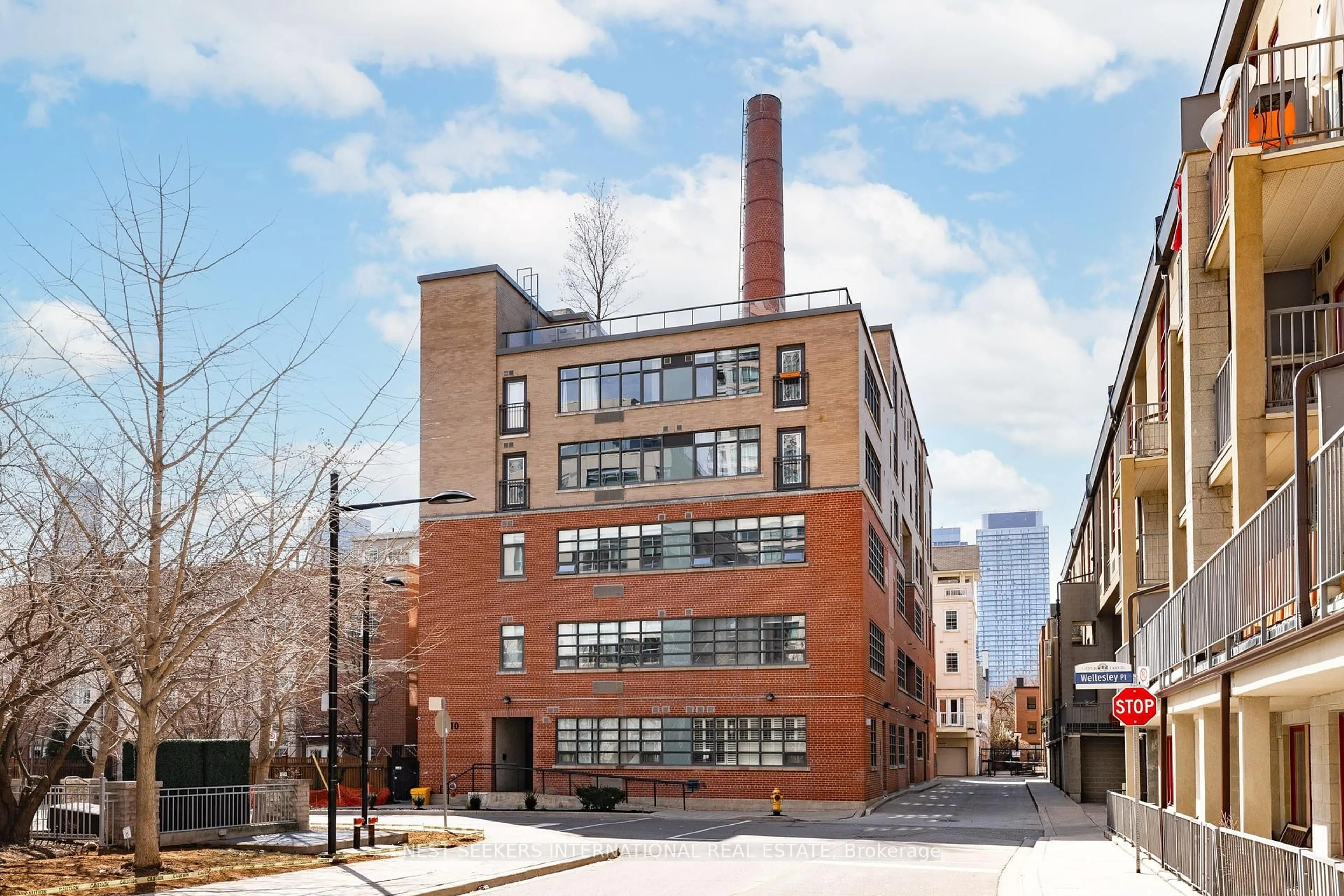 Home with brick exterior material, building for 10 Wellesley Pl #302, Toronto Ontario M4Y 1B1