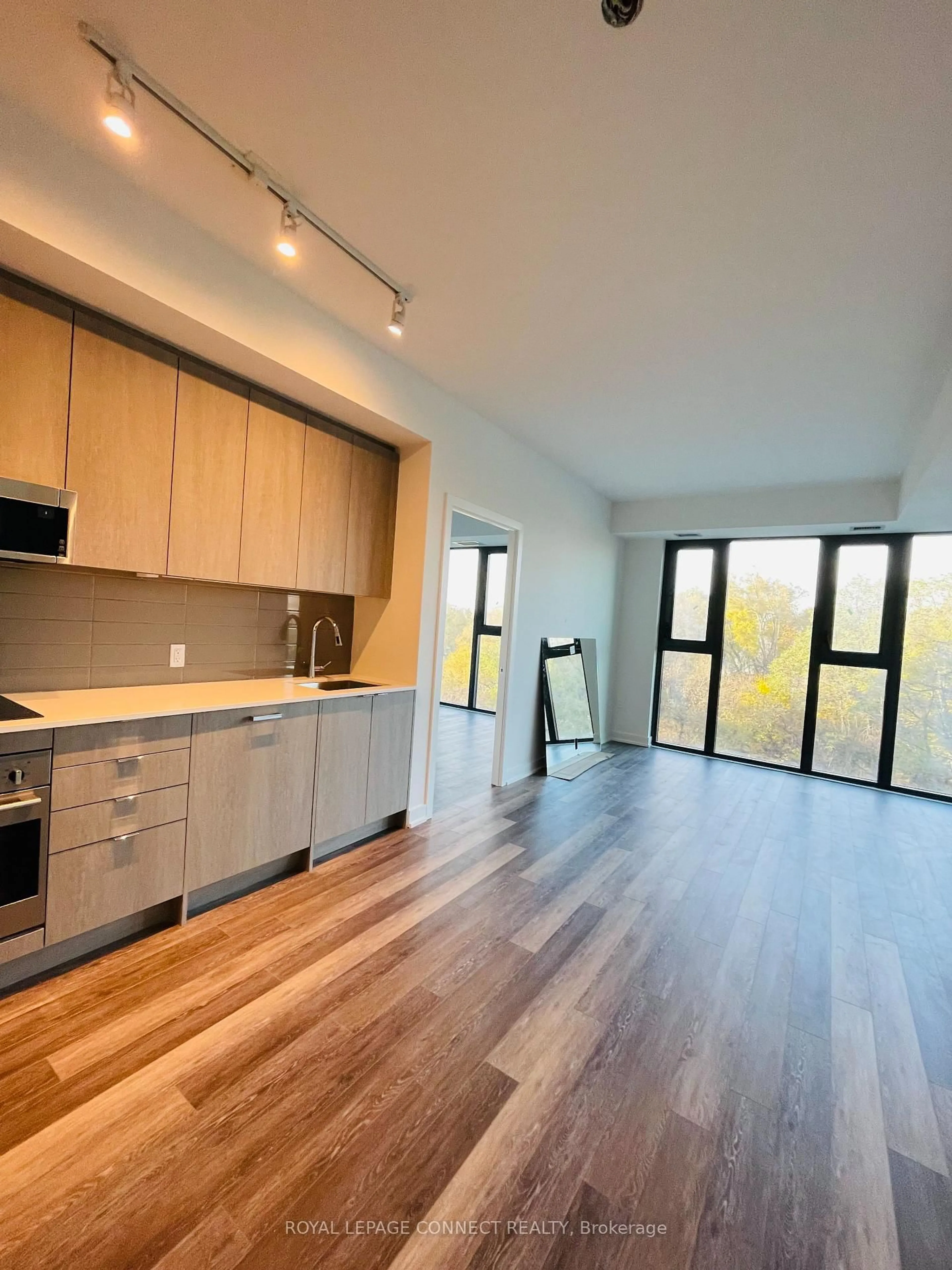 Open concept kitchen, wood/laminate floor for 250 Lawrence Ave #504, Toronto Ontario M5M 1B1