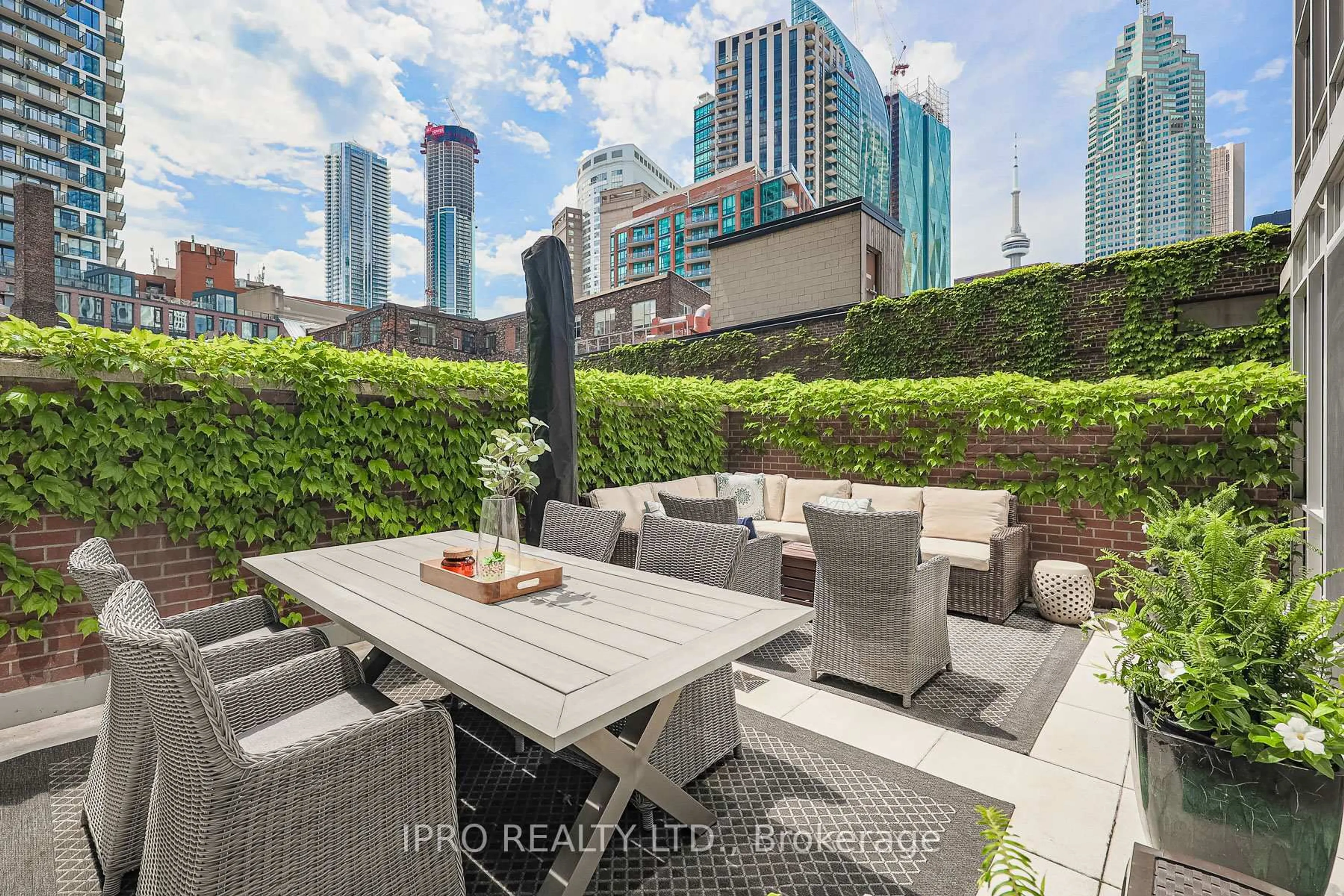 Patio, city buildings view from balcony for 55 Front St #314, Toronto Ontario M5E 0A7