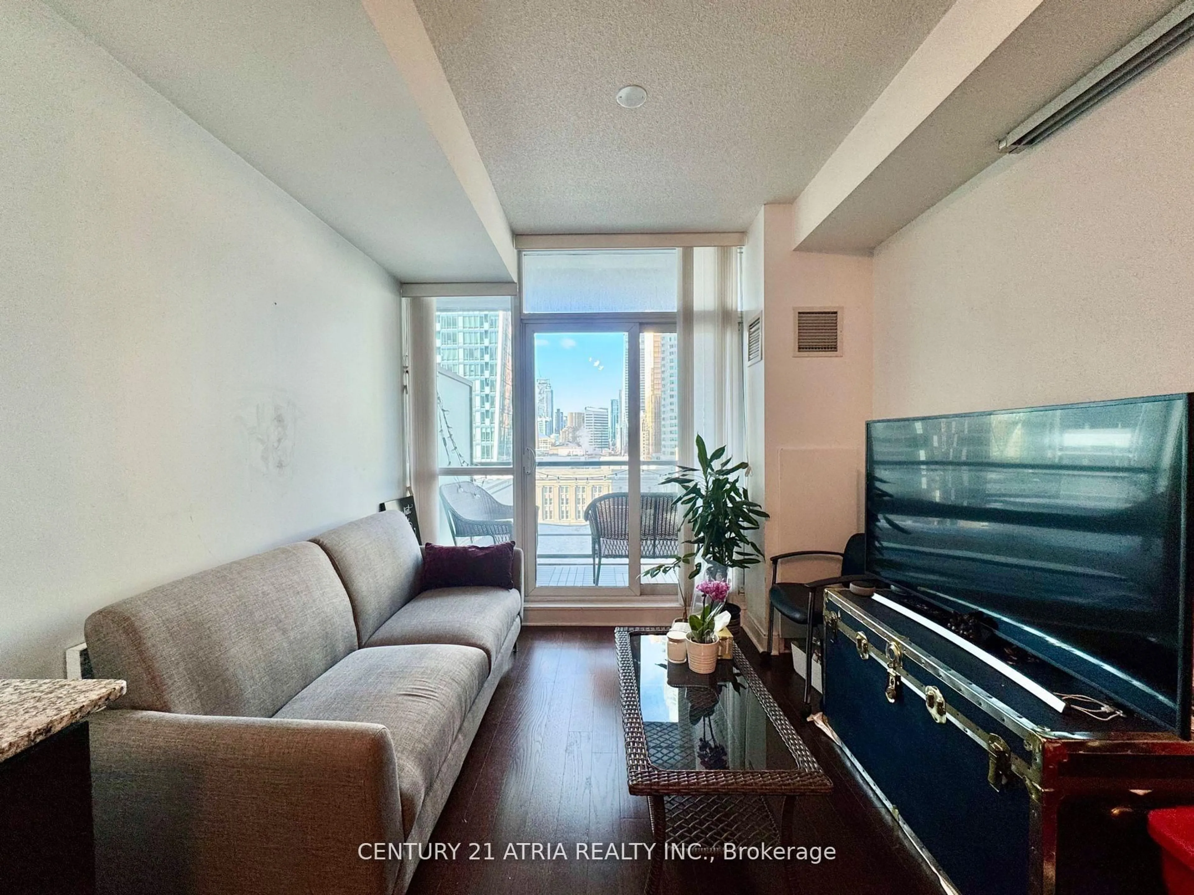 Living room with furniture, unknown for 1 Scott St #1305, Toronto Ontario M5E 1A1