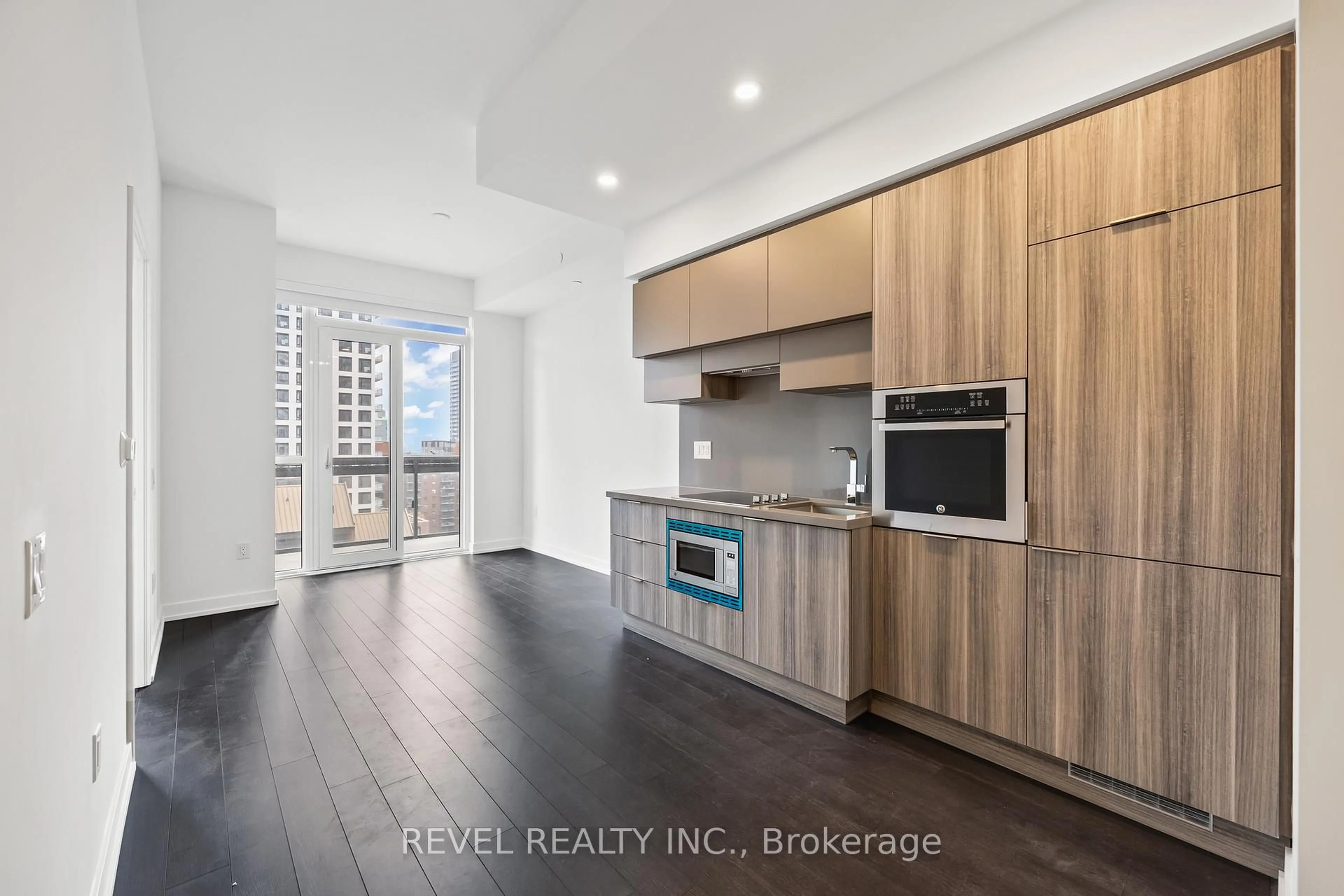 Open concept kitchen, wood/laminate floor for 39 Roehampton Ave #1210, Toronto Ontario M4P 1P9