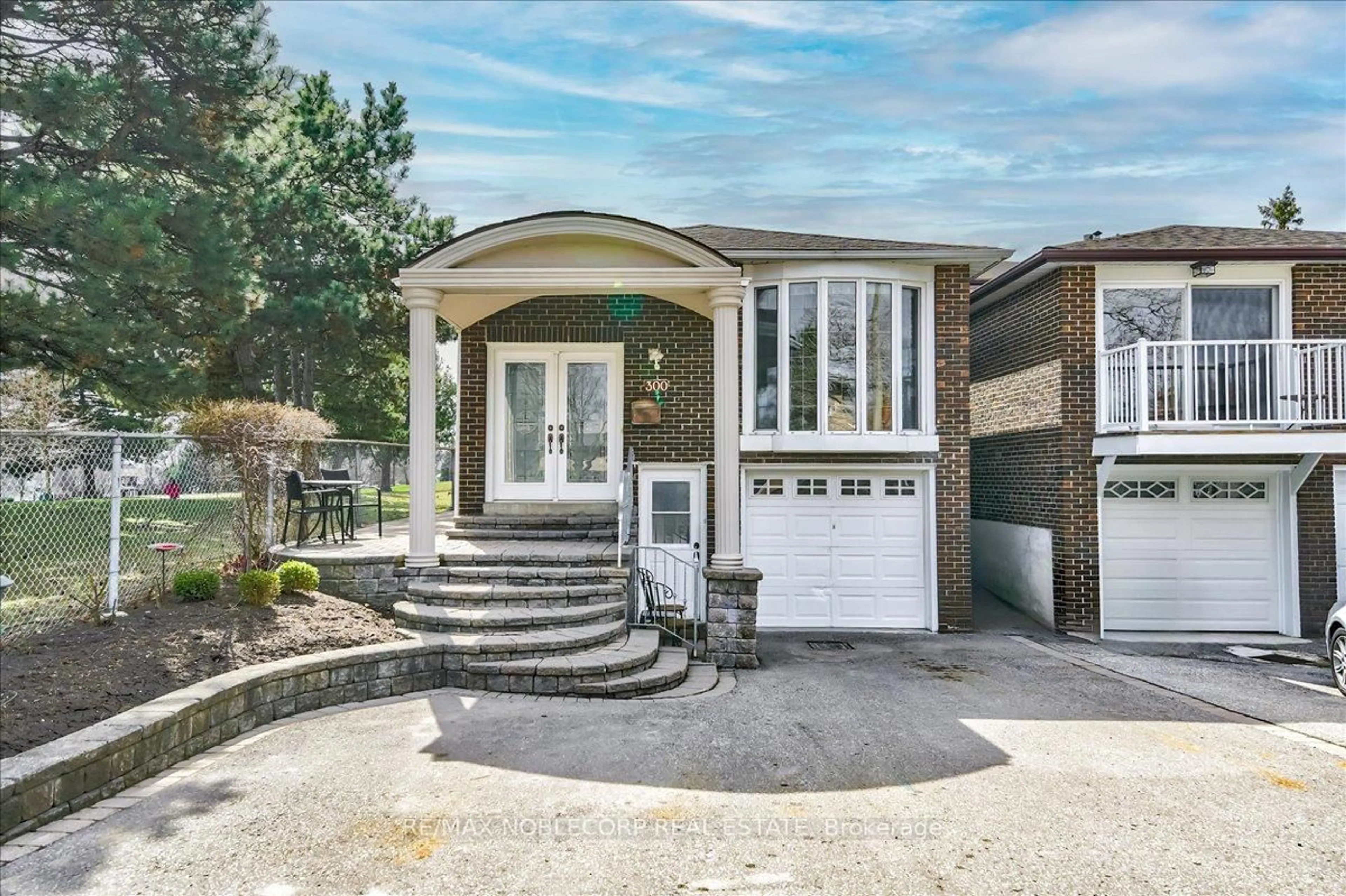 Home with brick exterior material, street for 300 Cherokee Blvd, Toronto Ontario M2H 2W7