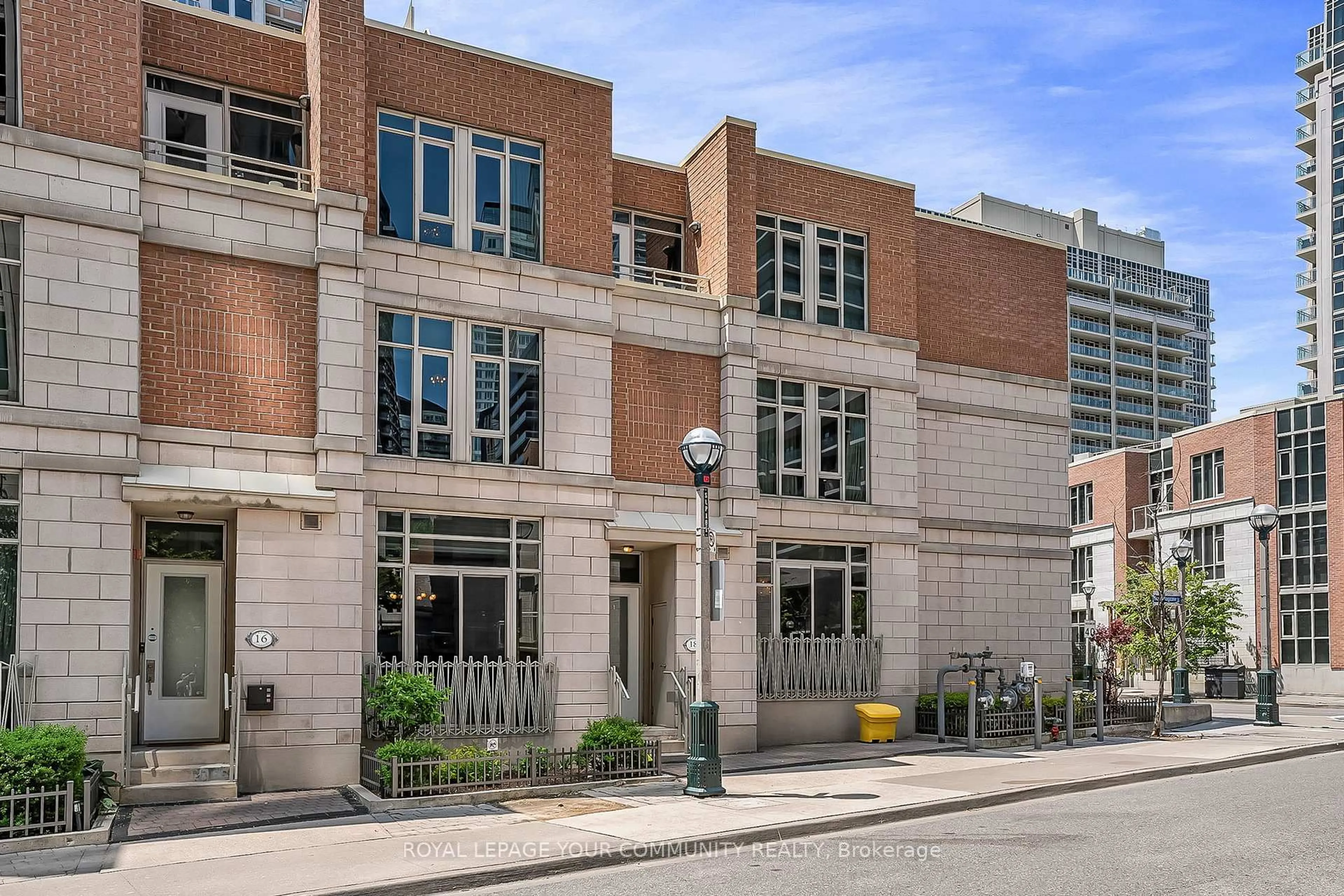 Home with brick exterior material, street for 18 Grand Magazine St #Town House 8, Toronto Ontario M5V 1B4