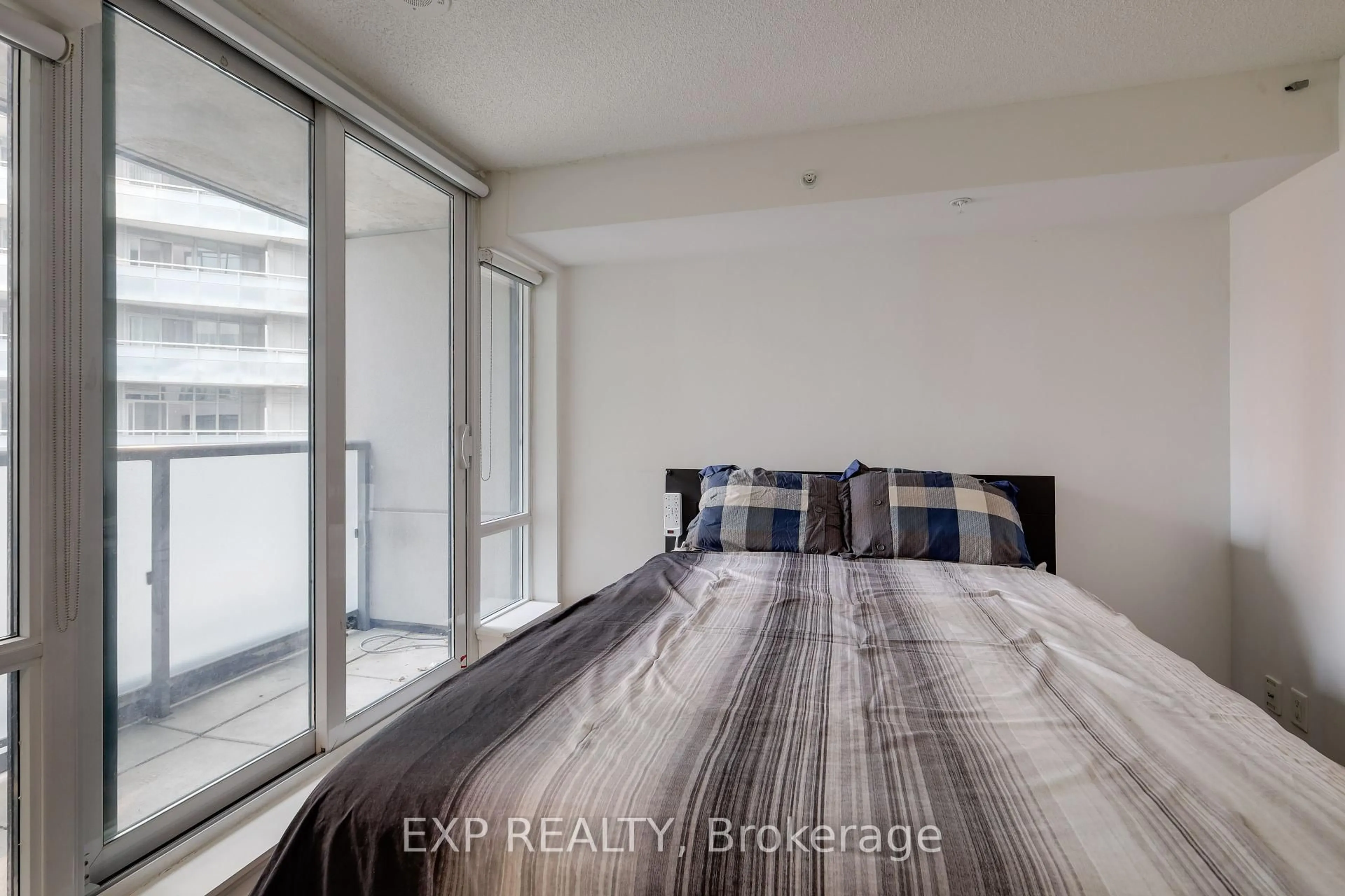 Bedroom with bed, unknown for 20 Joe Shuster Way #322, Toronto Ontario M6K 0A3