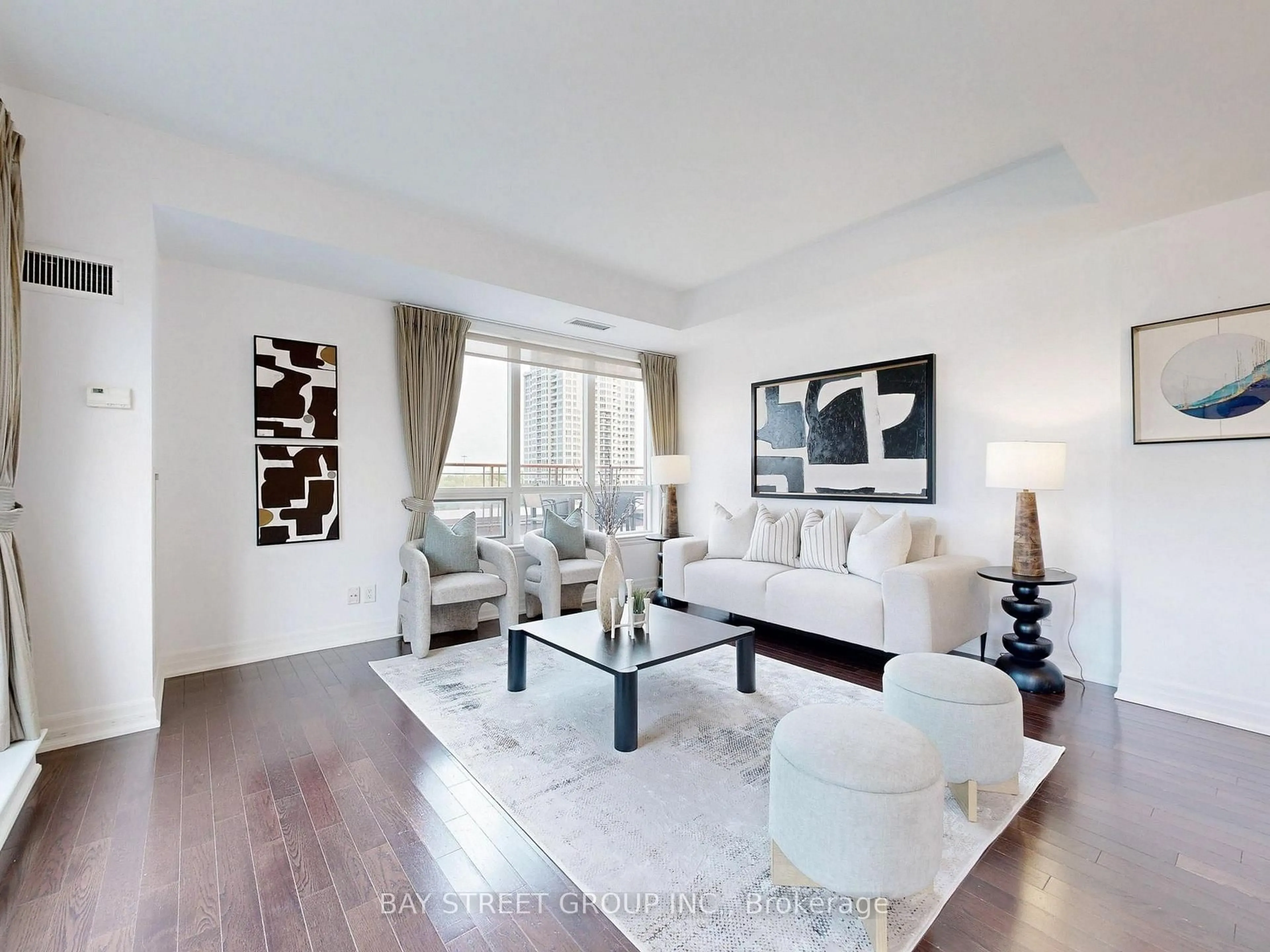 Living room with furniture, wood/laminate floor for 23 Rean Dr #705, Toronto Ontario M2K 0A5