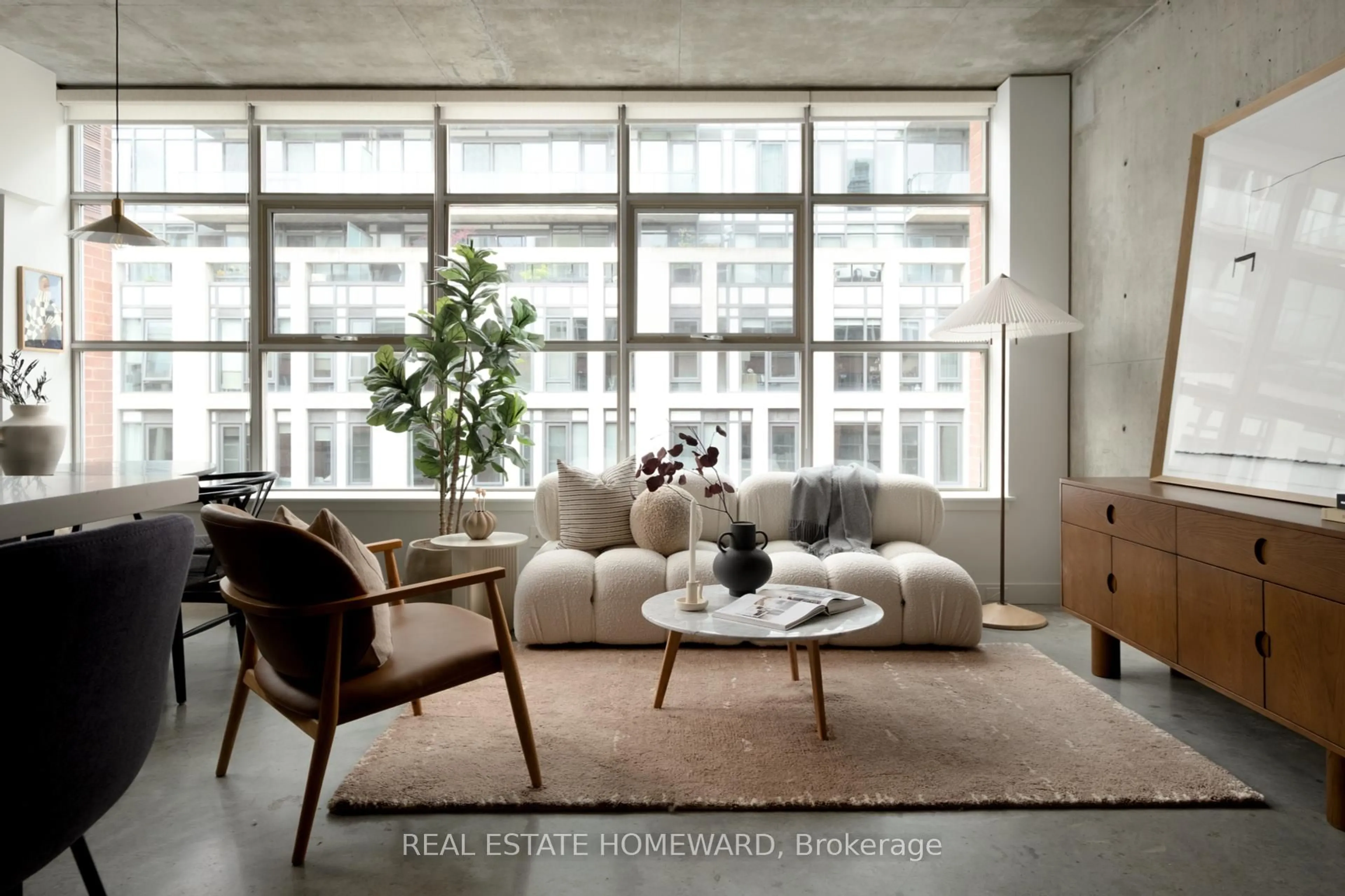 Living room with furniture, cement floor for 29 Camden St #601, Toronto Ontario M5V 3N3