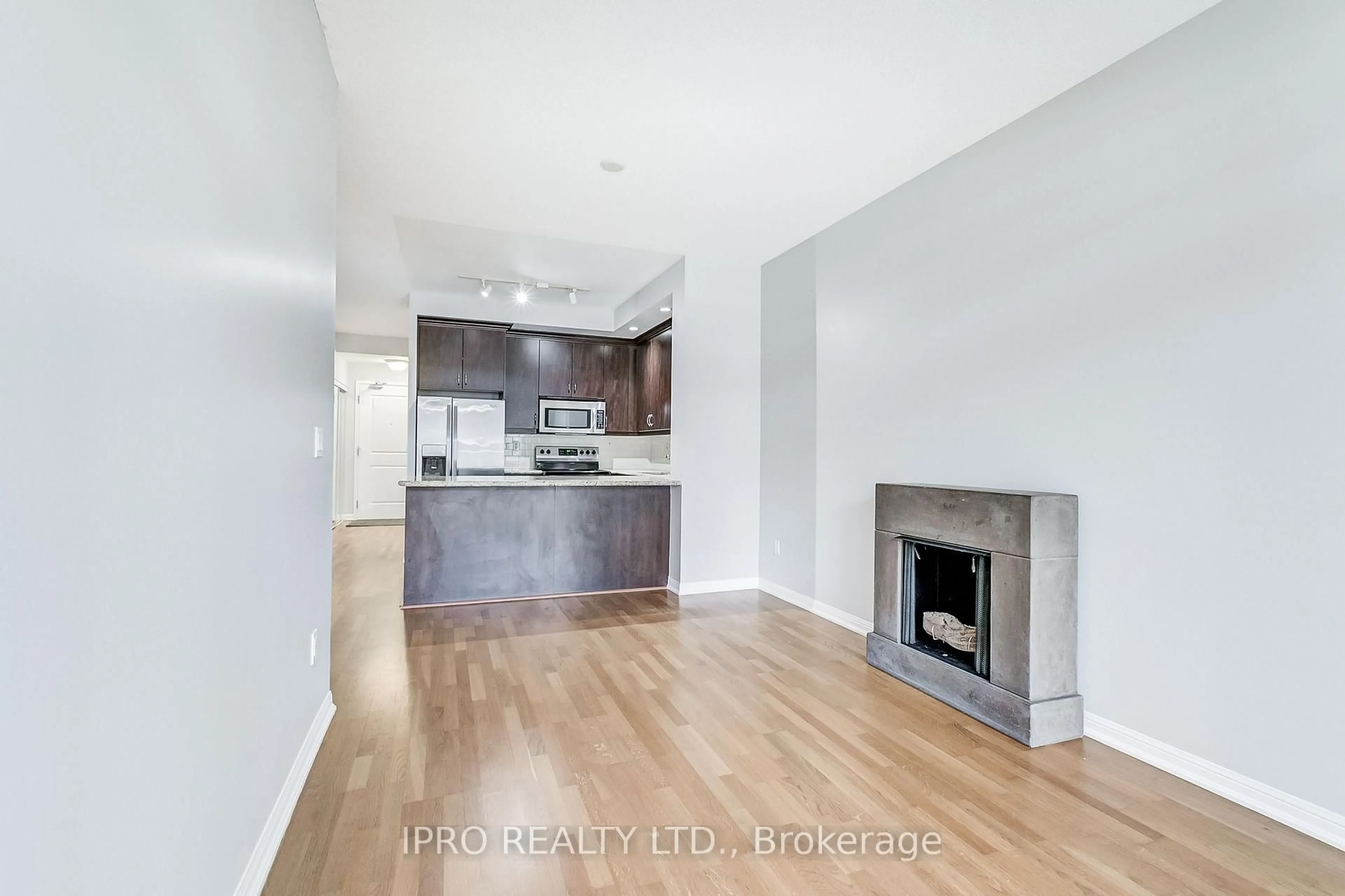 Open concept kitchen, wood/laminate floor for 21 Grand Magazine St #507, Toronto Ontario M5V 1B5