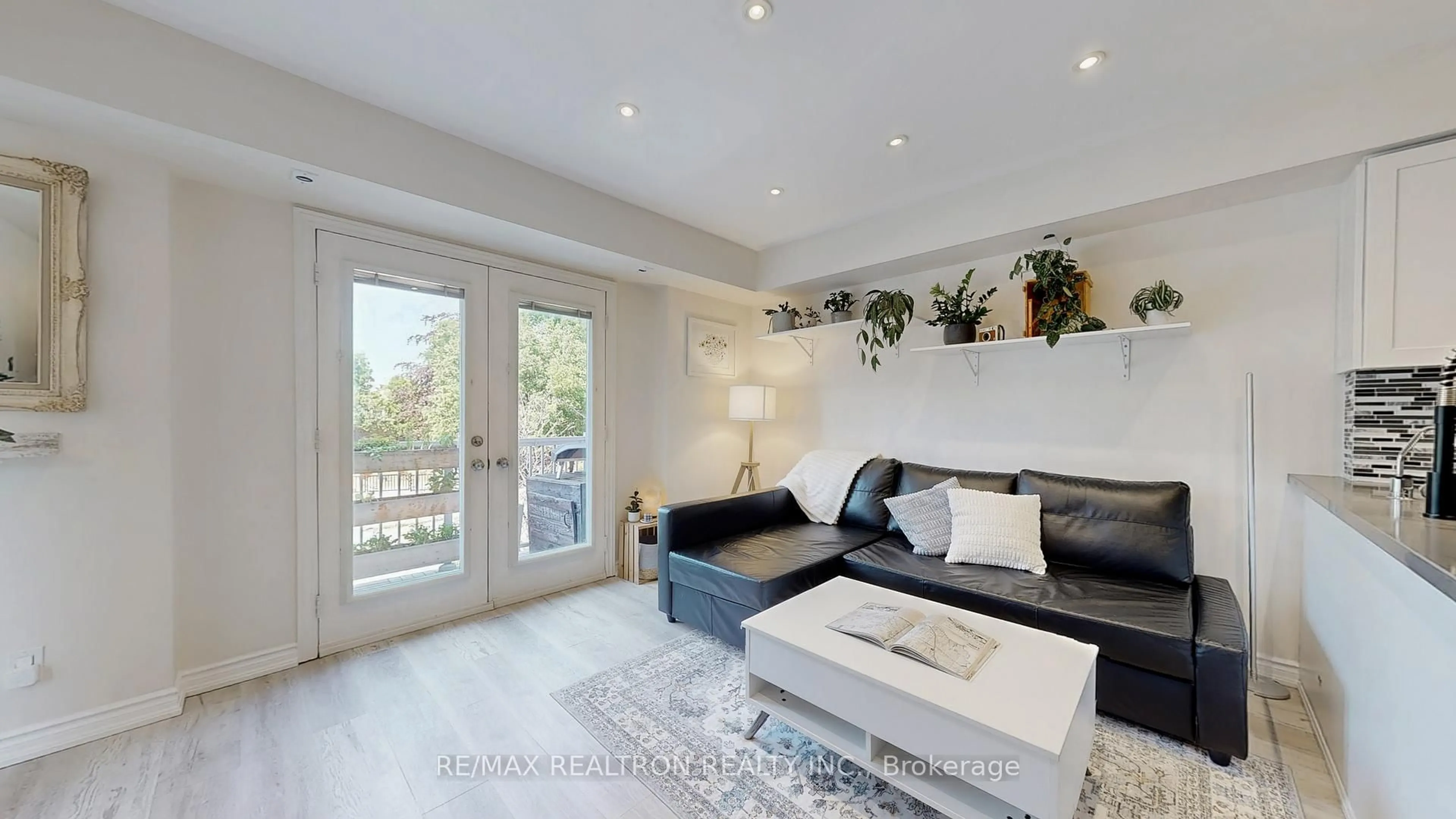 Living room with furniture, wood/laminate floor for 12 Sudbury St #406, Toronto Ontario M6J 3W7