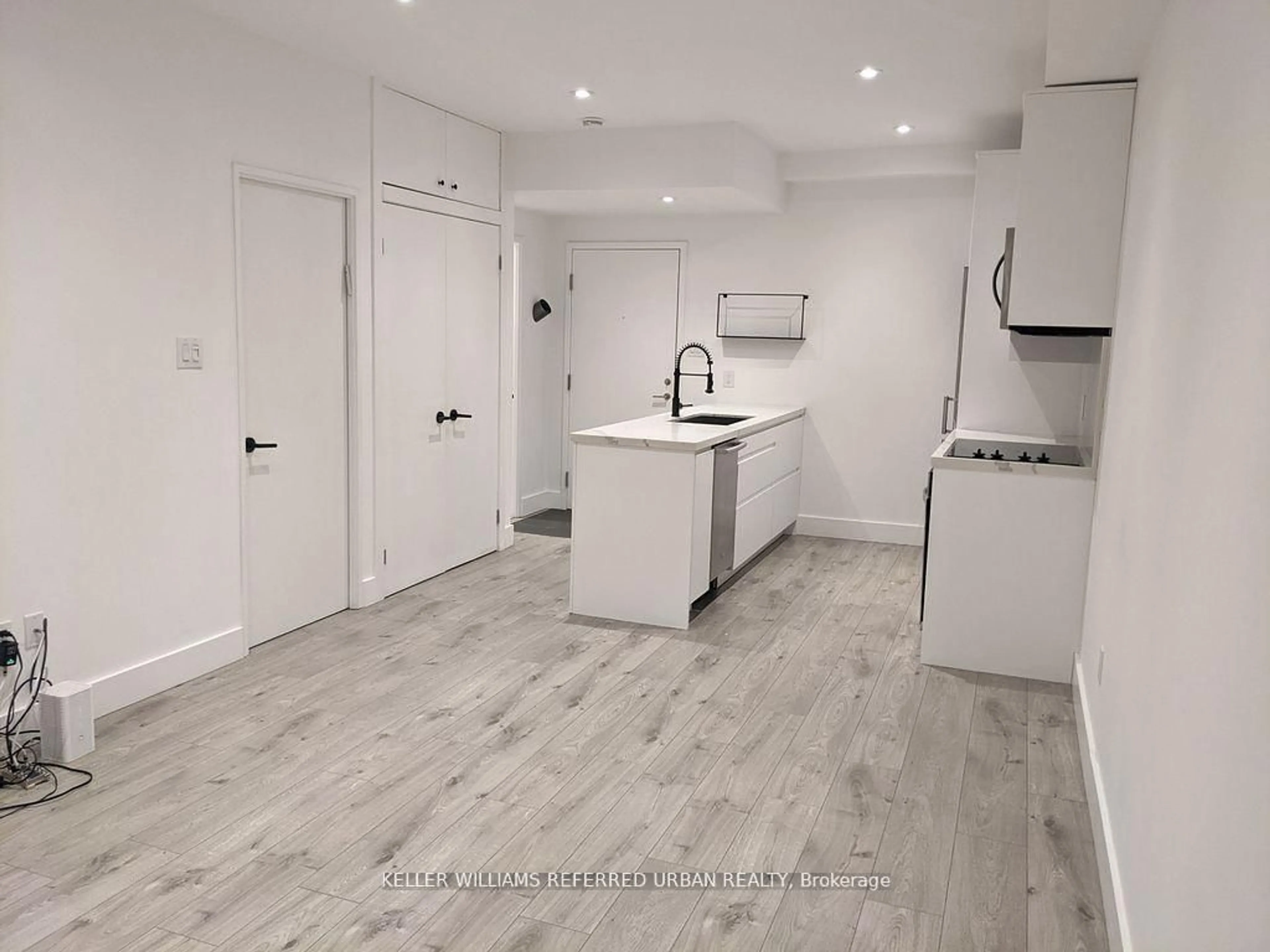 Open concept kitchen, wood/laminate floor for 3000 Bathurst St #110, Toronto Ontario M6B 3B4