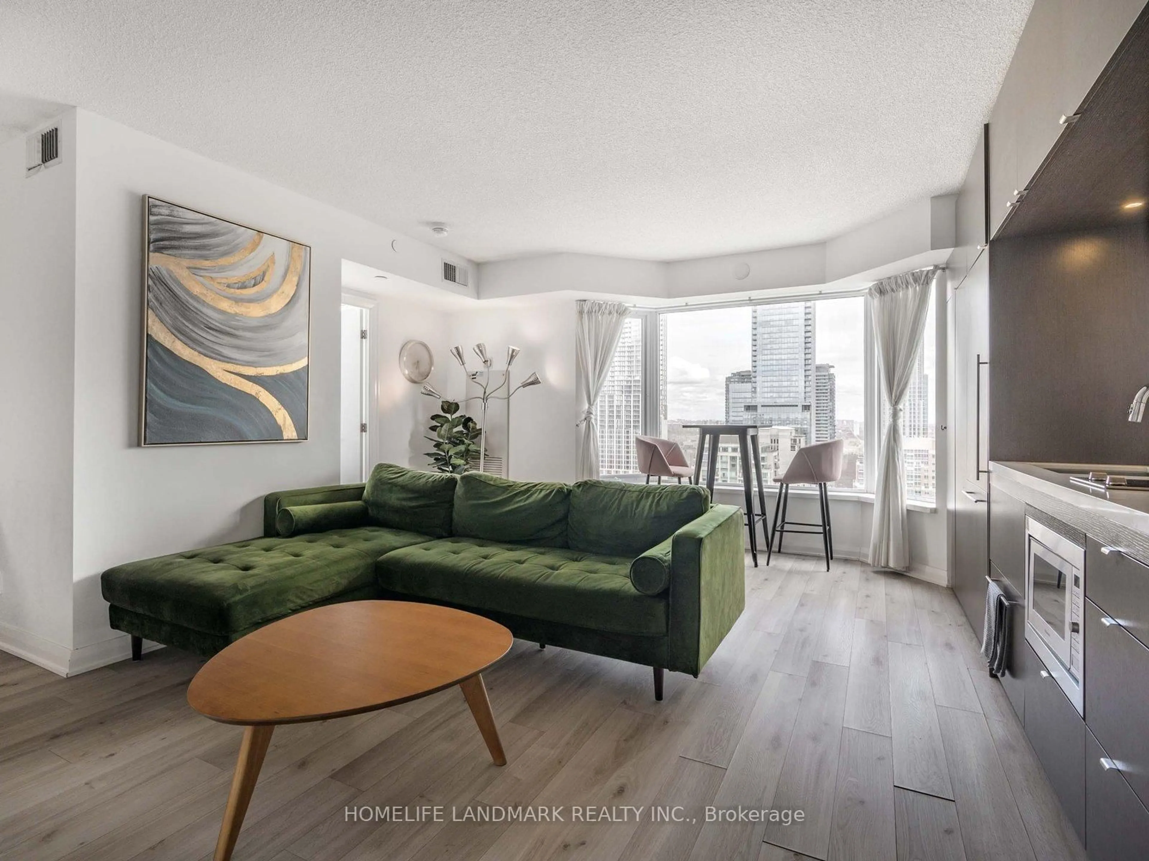 Living room with furniture, wood/laminate floor for 155 Yorkville Ave #2504, Toronto Ontario M5R 0B4