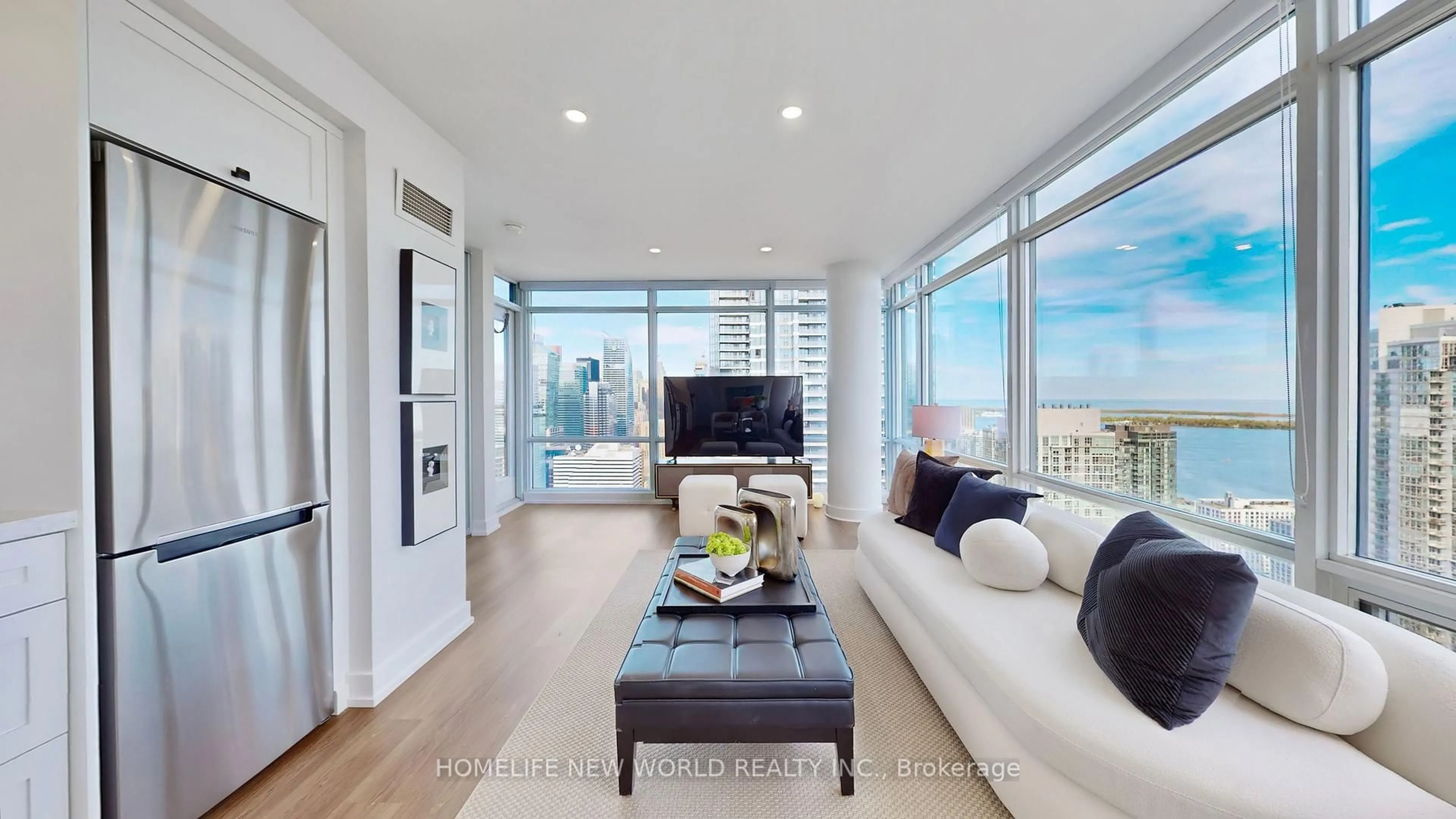 Living room with furniture, wood/laminate floor for 25 Telegram Mews #5106, Toronto Ontario M5V 3Z1