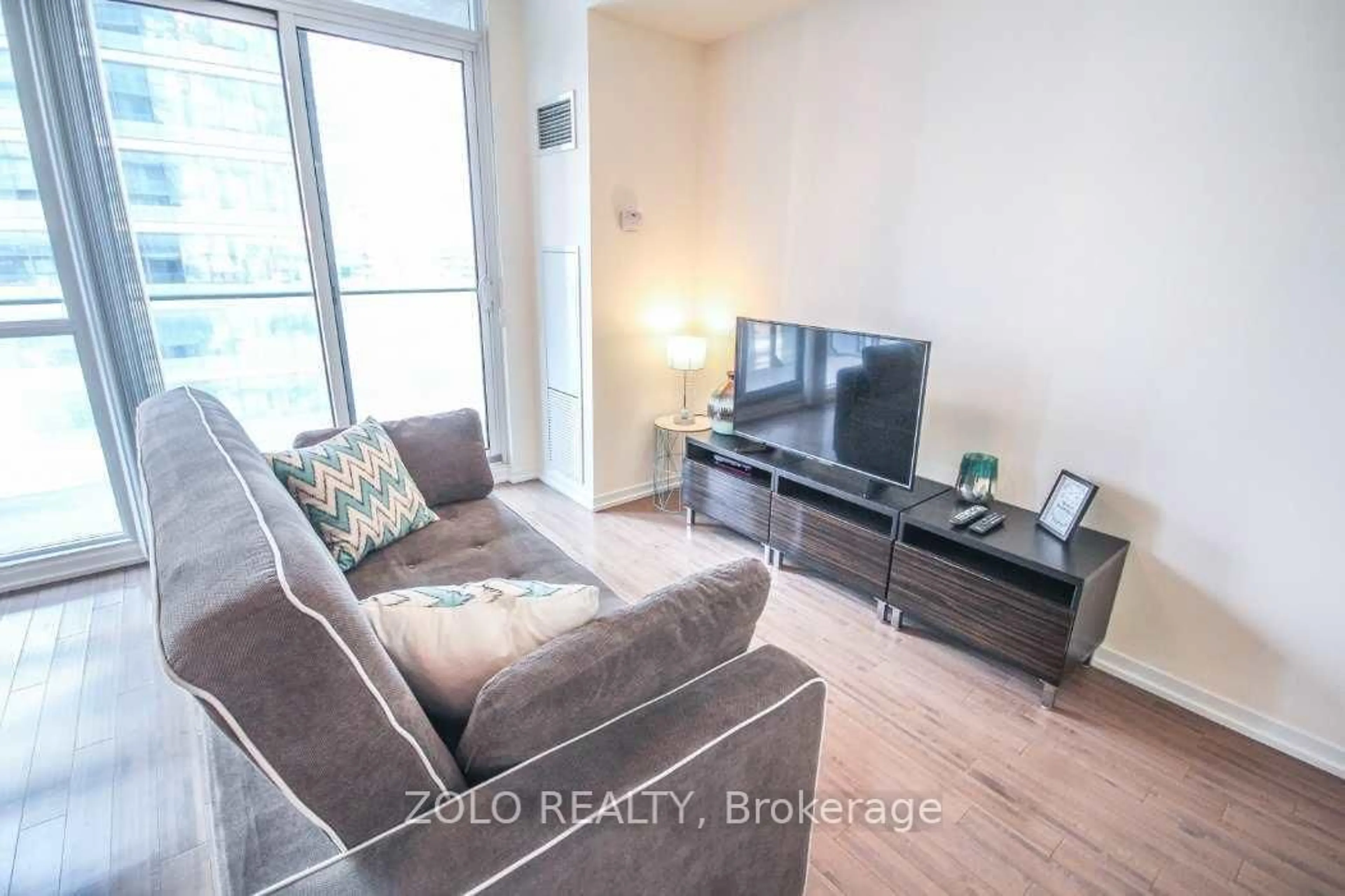 Living room with furniture, unknown for 65 Bremner Blvd #2007, Toronto Ontario M5J 0A7