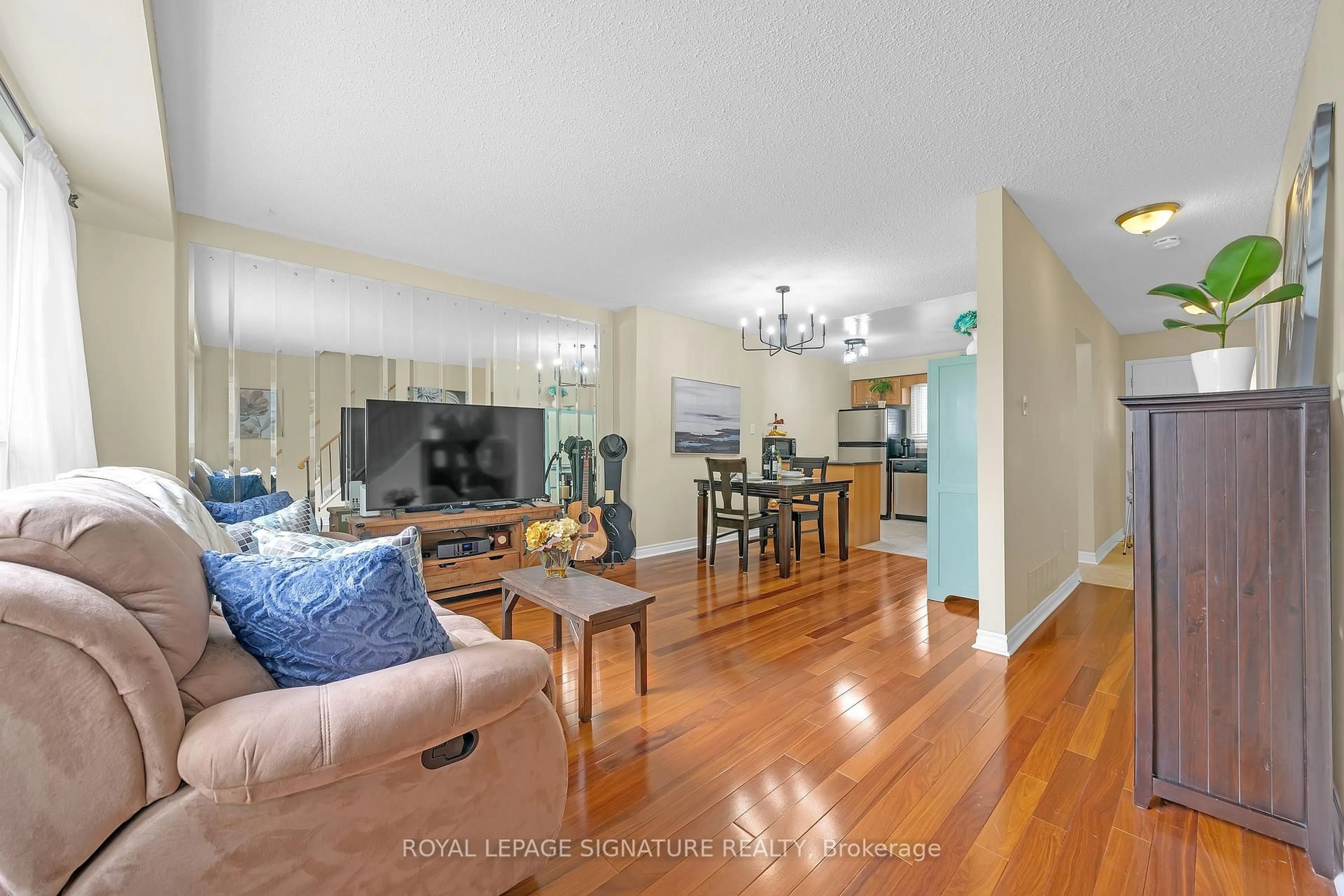 Living room with furniture, wood/laminate floor for 5 Early Apple Way, Toronto Ontario M3A 3N4