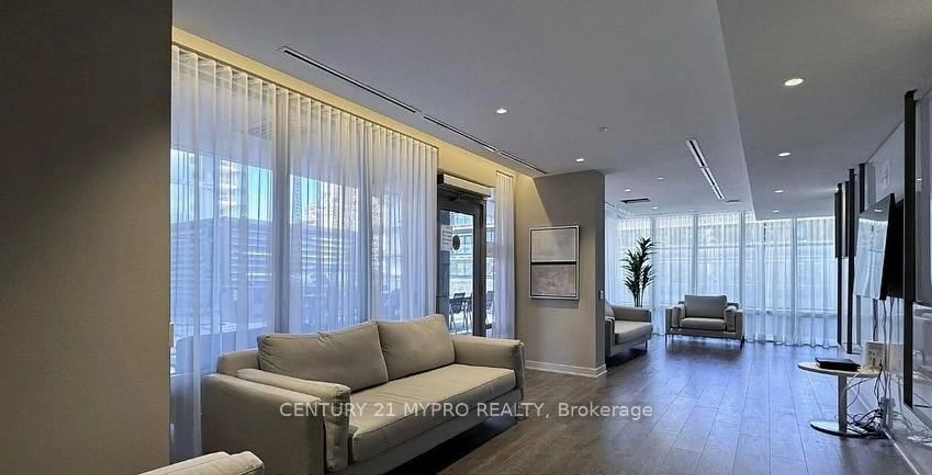 Living room with furniture, wood/laminate floor for 195 Redpath Ave #1713, Toronto Ontario M4P 0E4