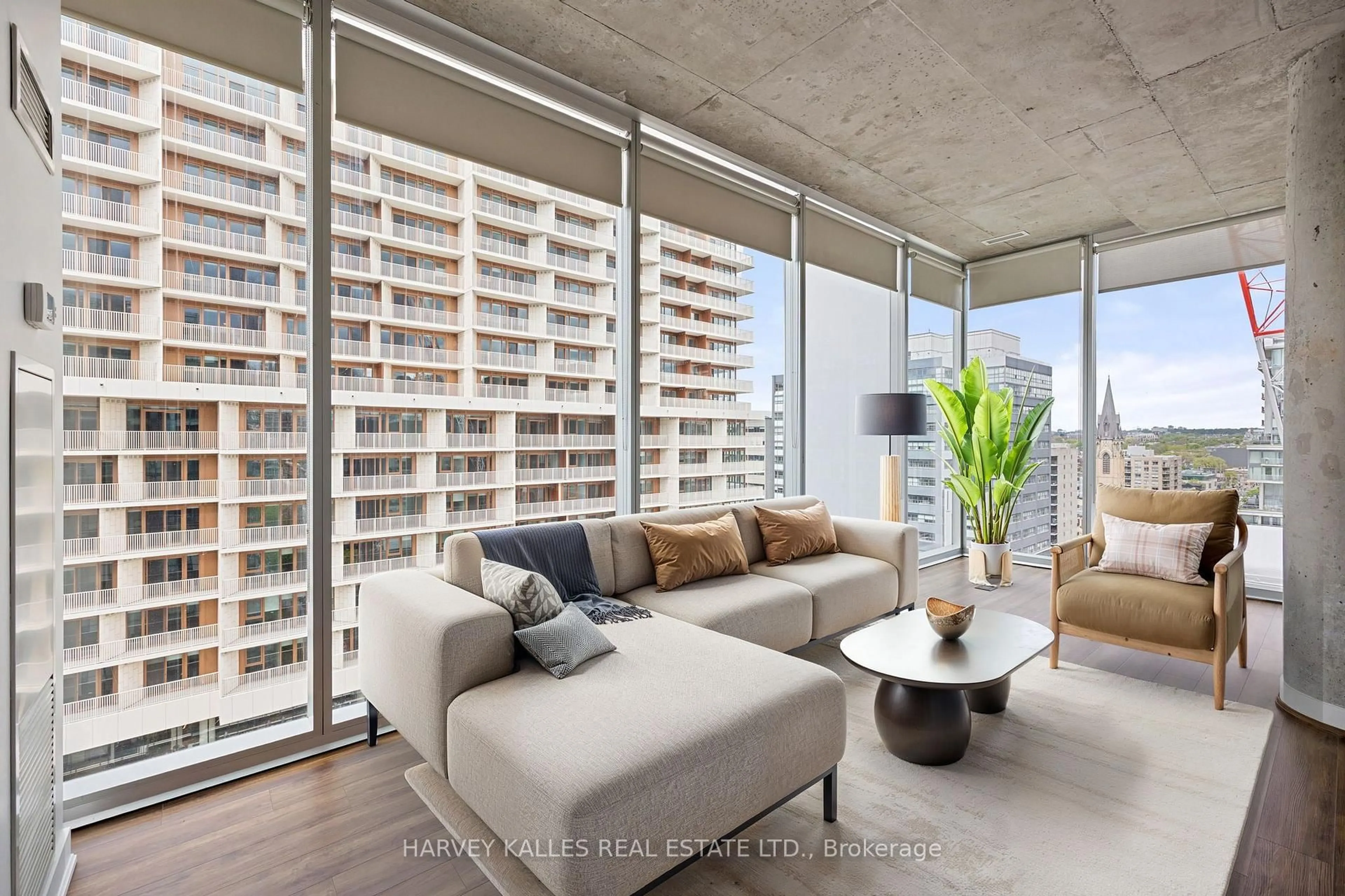 Living room with furniture, cement floor for 552 Wellington St #1305, Toronto Ontario M5V 2V5