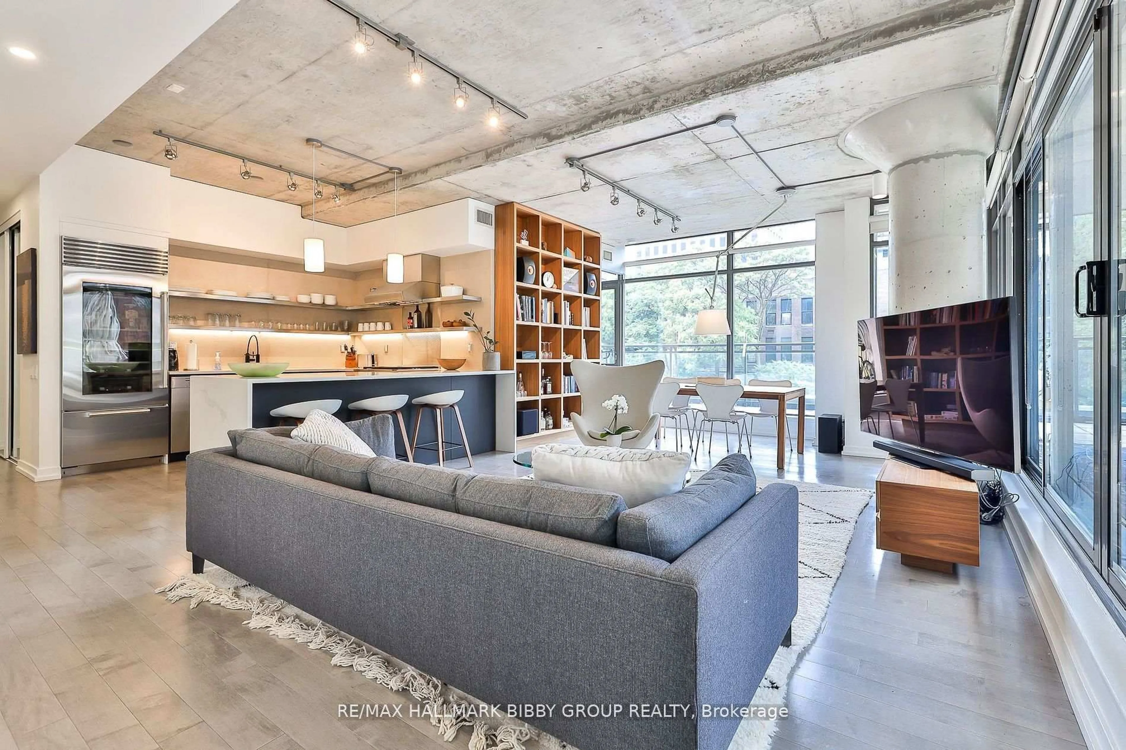 Living room with furniture, cement floor for 10 Morrison St #305, Toronto Ontario M5V 2T8
