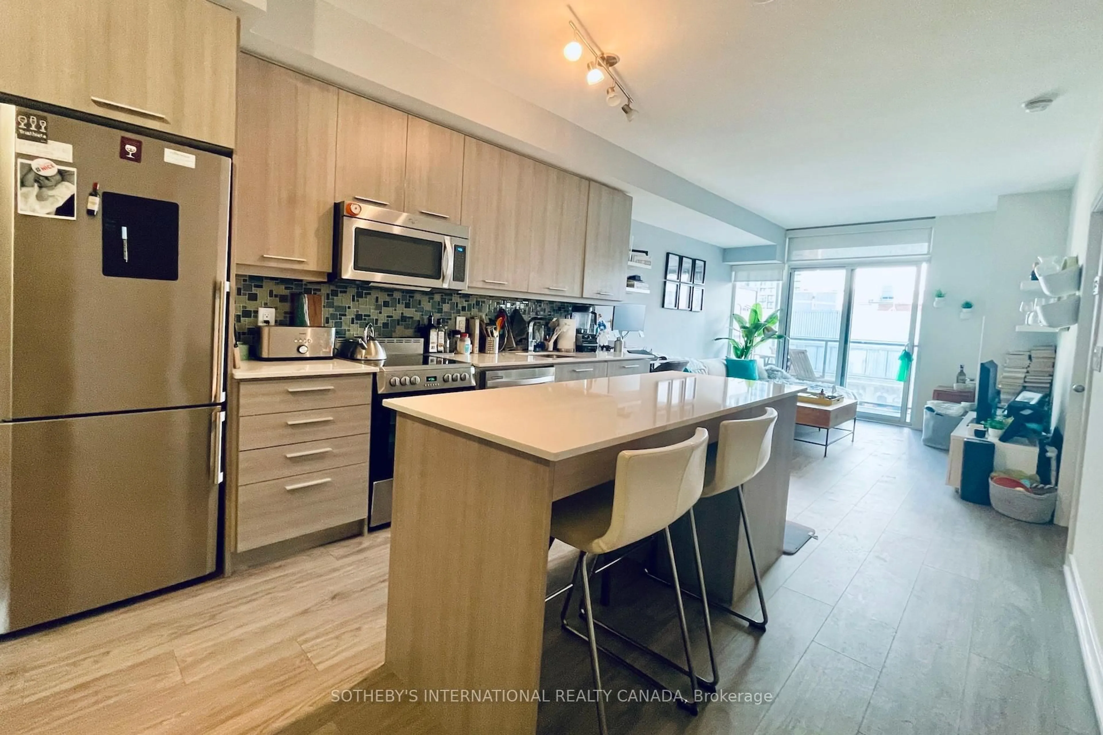 Open concept kitchen, wood/laminate floor for 105 George St #706, Toronto Ontario M5A 0L4