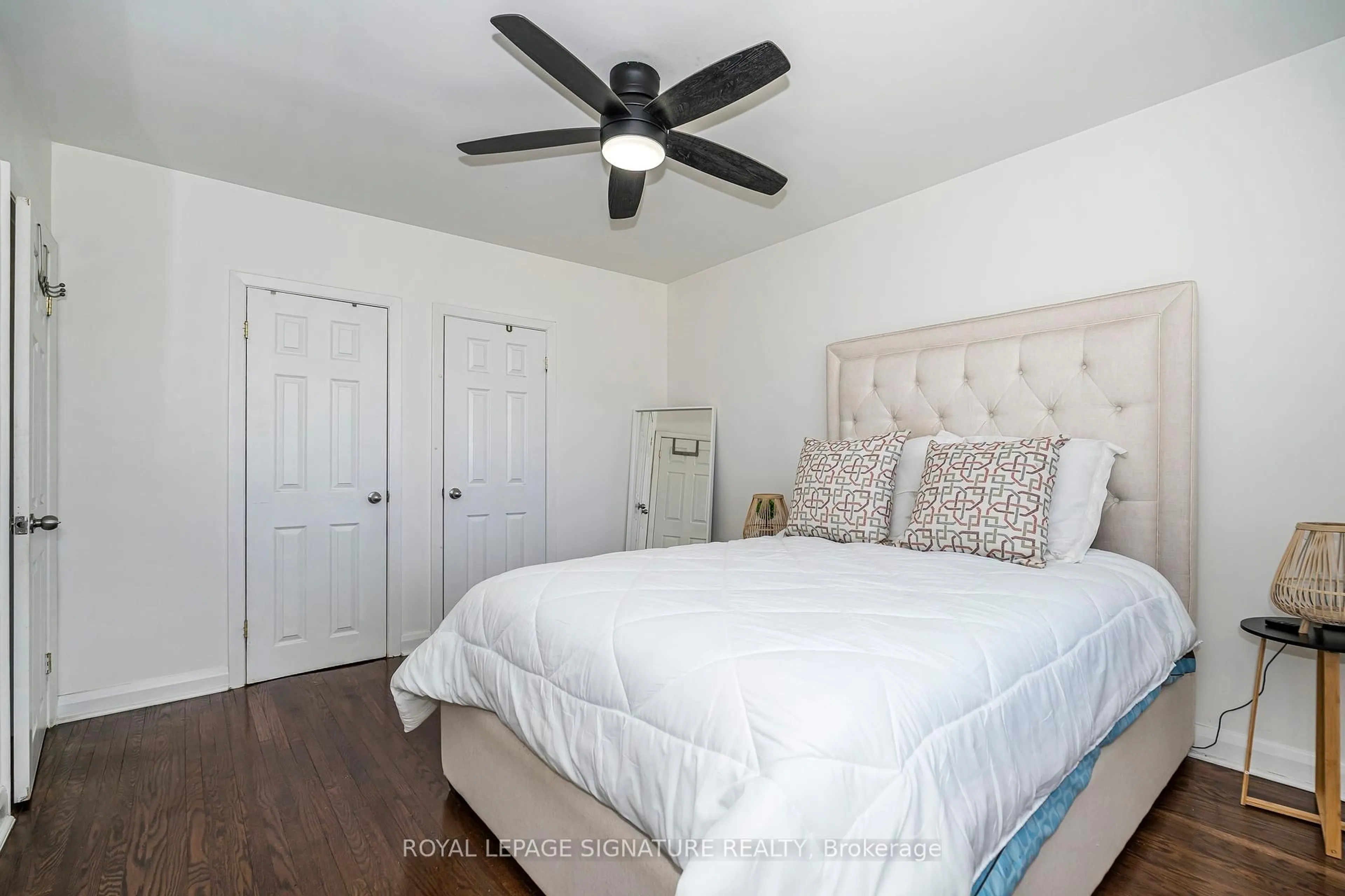 Bedroom with bed, wood/laminate floor for 136 Regina Ave, Toronto Ontario M6A 1R7
