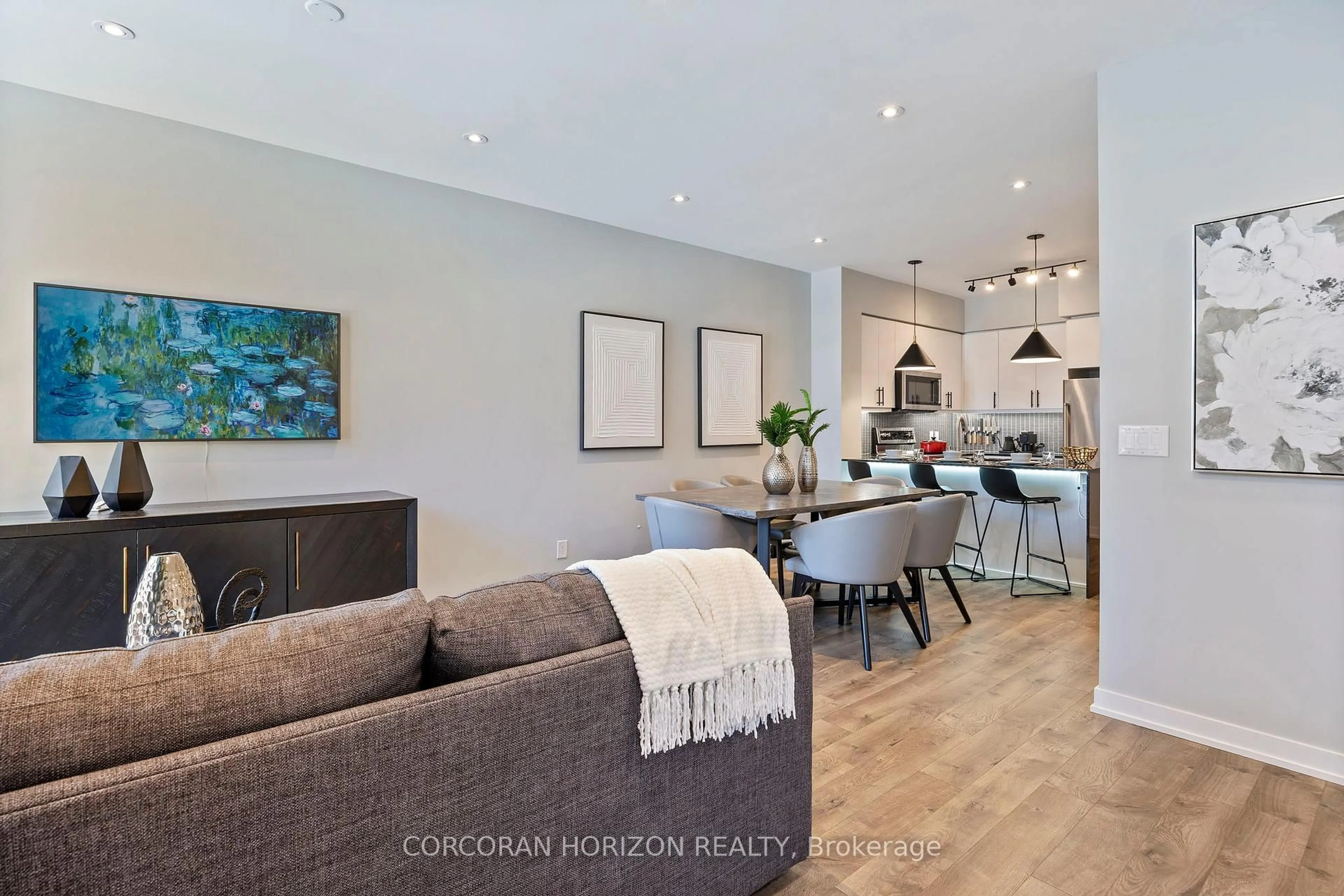 Open concept kitchen, wood/laminate floor for 70 Lanark Ave, Toronto Ontario M6E 2G4