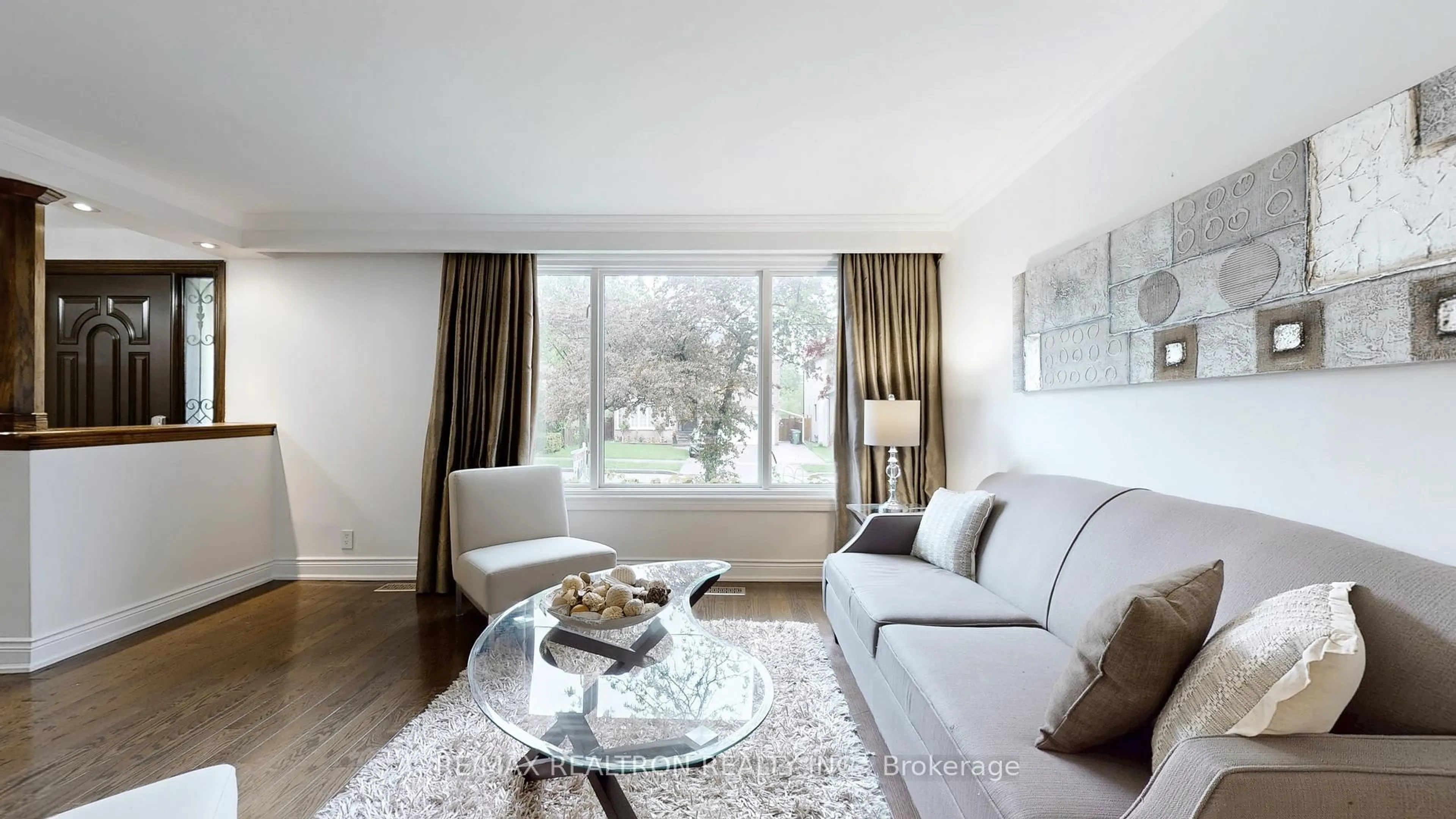 Living room with furniture, wood/laminate floor for 37 Newton Dr, Toronto Ontario M2M 2M6