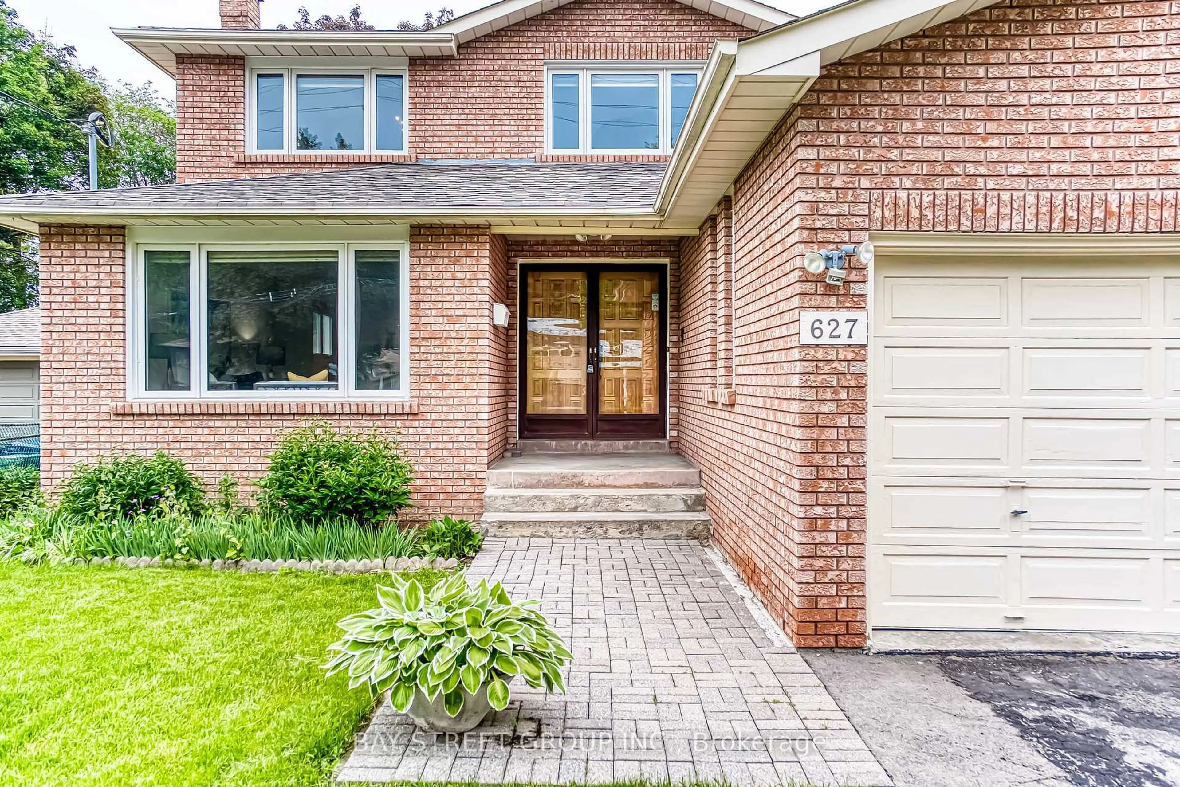 Home with brick exterior material, street for 627 Conacher Dr, Toronto Ontario M2M 3N2