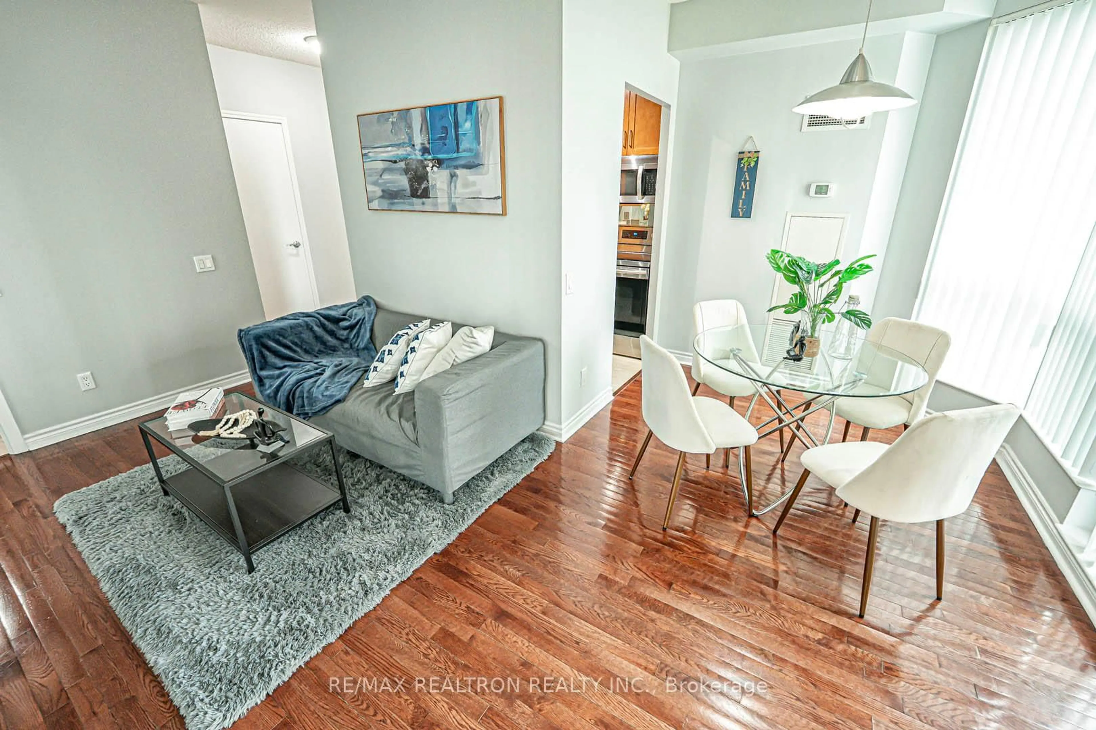 Living room with furniture, wood/laminate floor for 60 Byng Ave #811, Toronto Ontario M2N 4K3