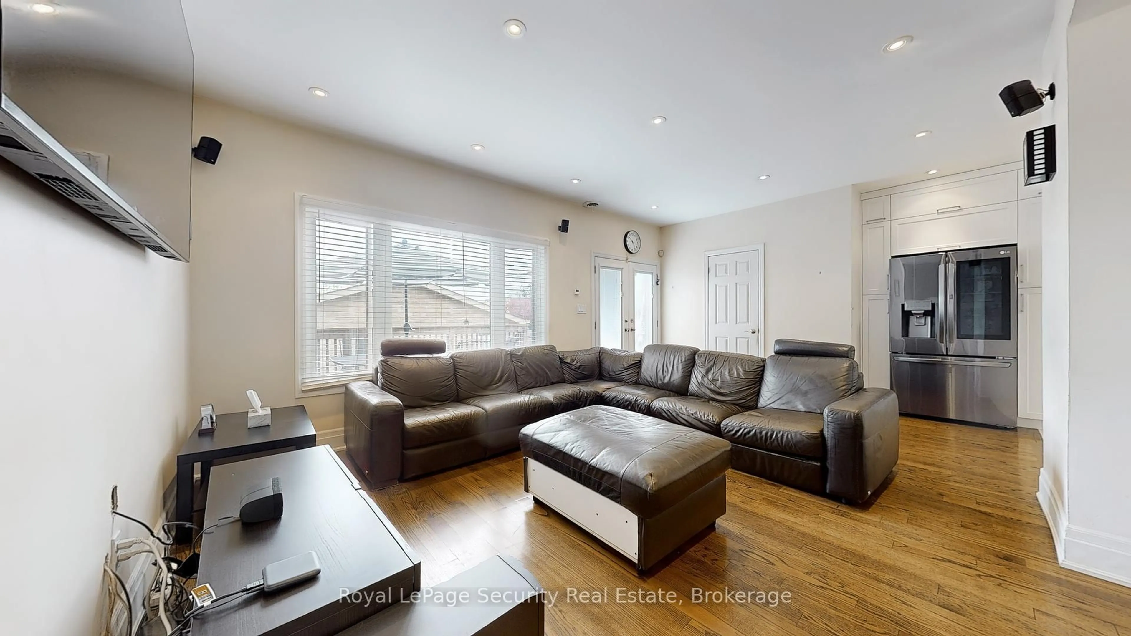 Living room with furniture, wood/laminate floor for 35 Regal Rd, Toronto Ontario M6H 2J6
